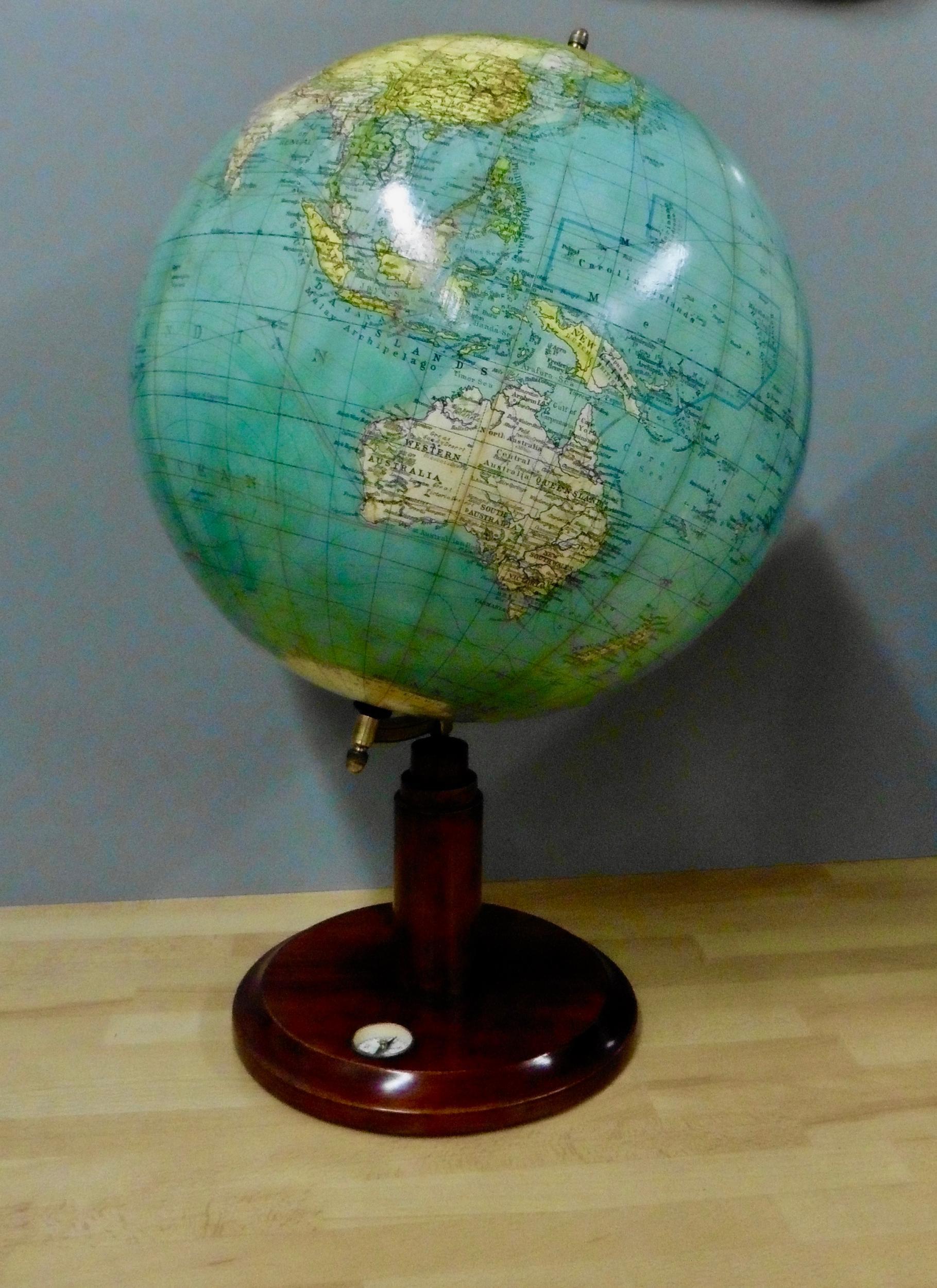 Edwardian celestial globe

Edwardian celestial globe standing on a circular mahogany base with inset compass and stepped pillar support with polished brass Meridian marked from 0 to 80 degrees, surmounted by a turned finial.

The globe is in