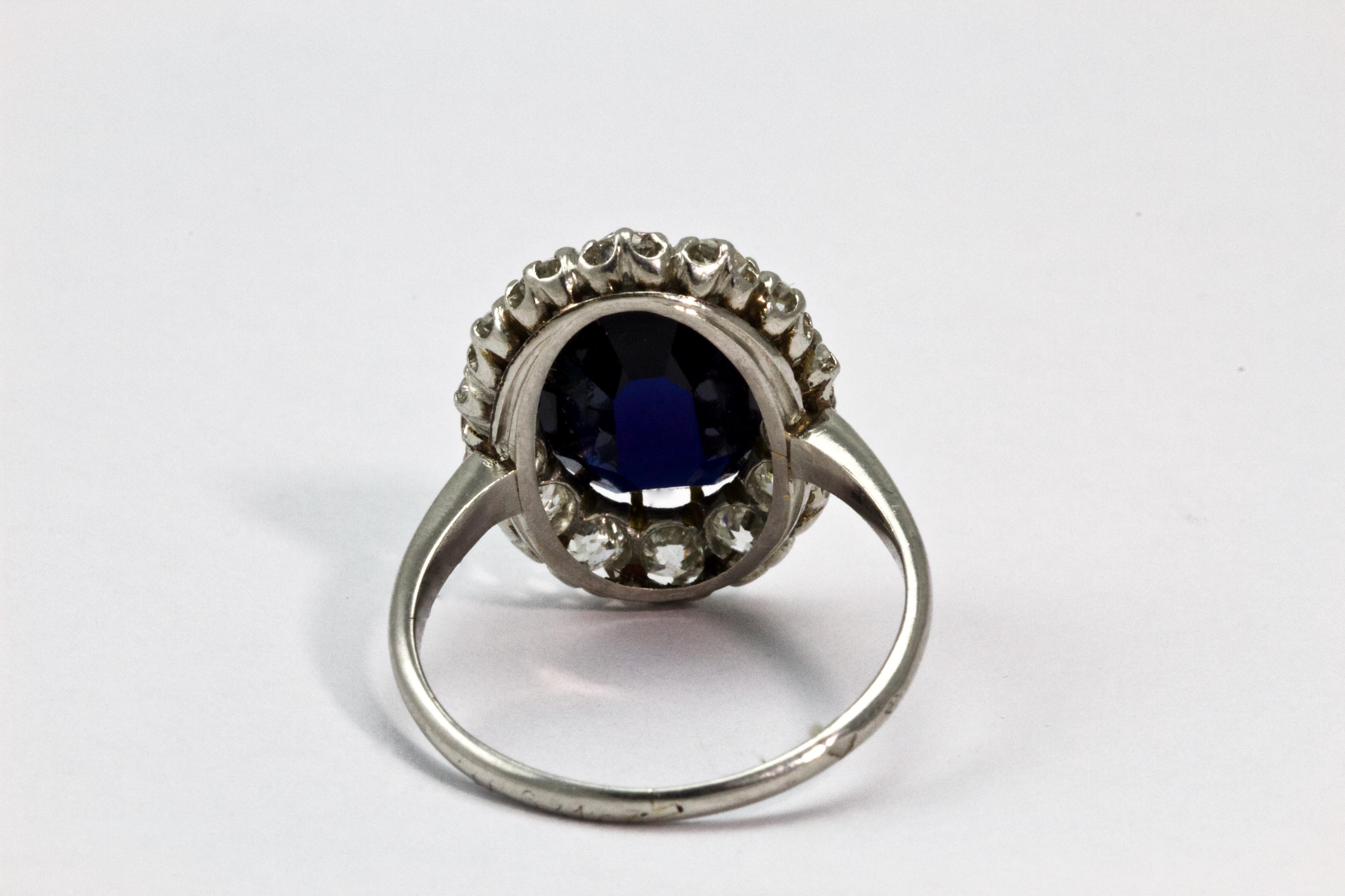 Oval Cut Edwardian Certified 4.88 Carat Sapphire and Diamond Platinum Cluster Ring