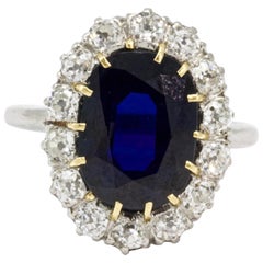 Edwardian Certified 4.88 Carat Sapphire and Diamond Platinum Cluster Ring