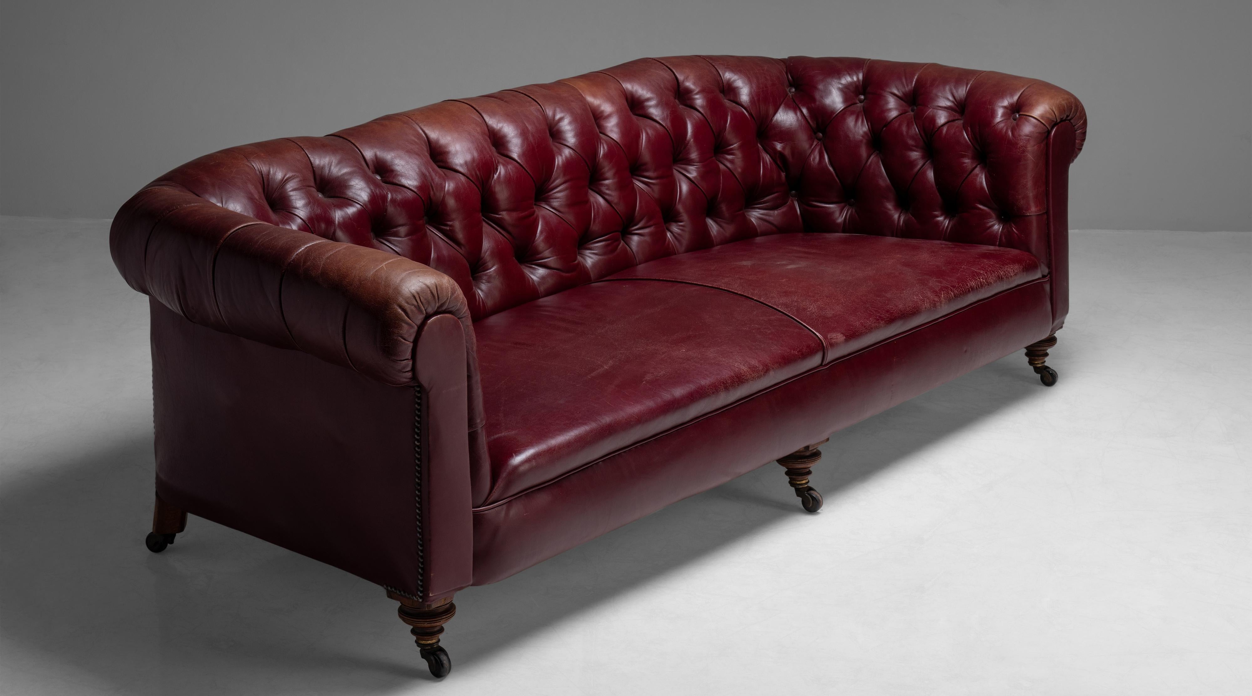 Edwardian Chesterfield sofa
England circa 1890
Deep button back Chesterfield with original red leather upholstery on turned feet with castors.
Measures: 90.75”W x 40”D x 28.5” H
 
$ 9,500.
  
