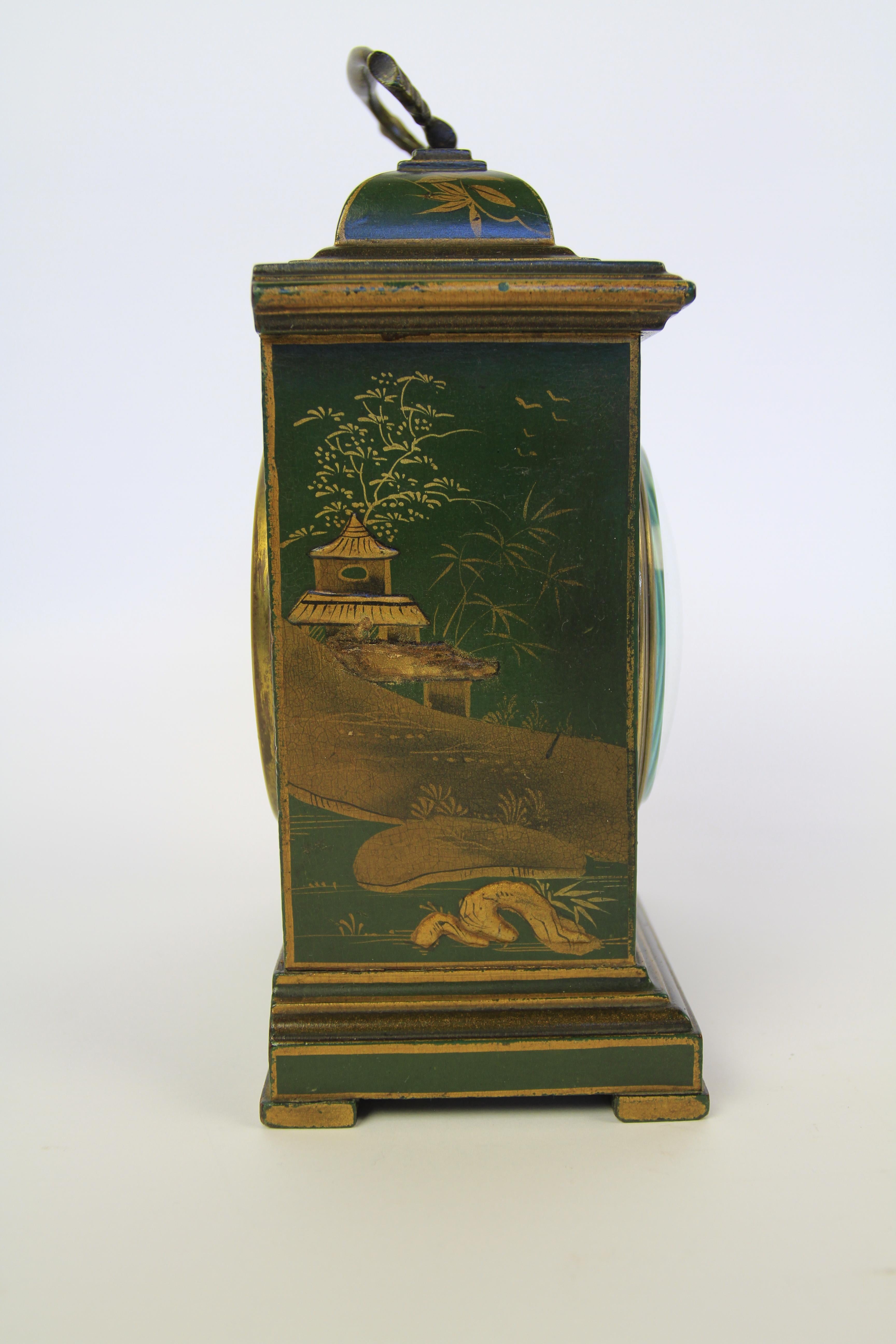 Edwardian Chinoiserie Decorated Mantel Clock
Green case with Gold Chinoiserie Decoration
[ Photos show a blue strip on top dome , not there just a relection from the brass handle]
Bevelled Dome Glass, cream enamel face
French 8 day movement with