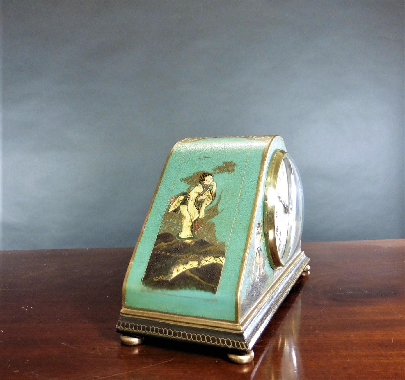 Edwardian Chinoiserie decorated mantel clock, Thornhill, London.

Shaped case with raised Chinoiserie decoration on a turquoise ground resting on a stepped plinth with four brass bun feet.

Silvered dial with Roman numerals, original ‘blued’