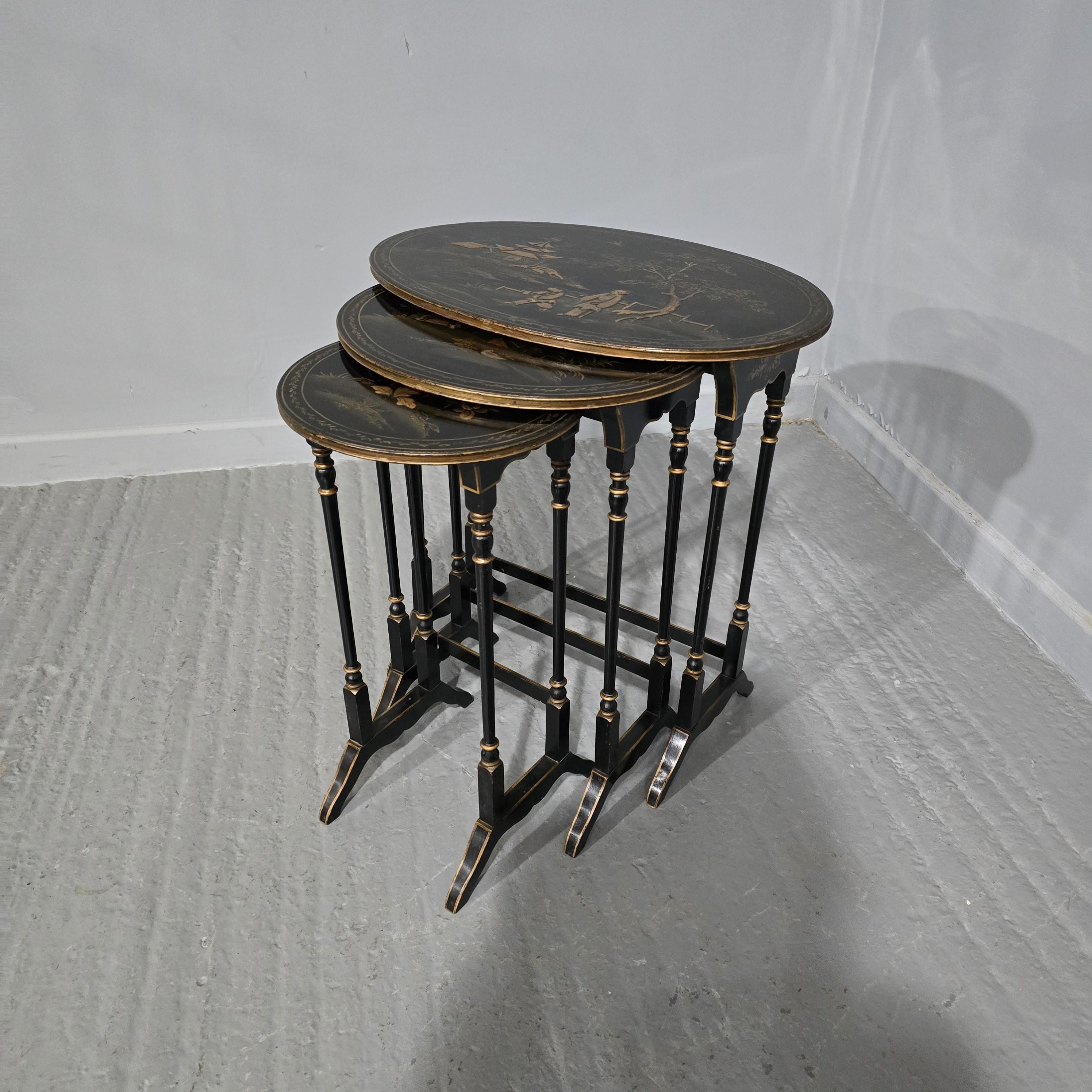 A good nest of three chinoiserie tables, from the largest oval to the smallest round, in very good overall condition.

24