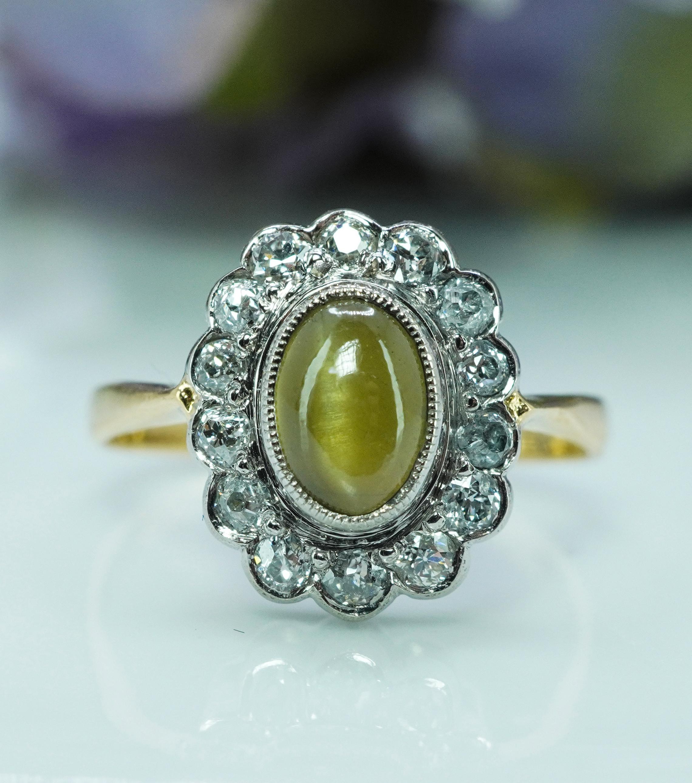  Antique Edwardian Chrysoberyl Cats Eye Old European Diamond Ring 18K Gold Platinum Hallmarked Estate Jewelry

This is a beautiful detailed antique ring crafted in rich 18K yellow gold and platinum, hallmarked AH (see picture). It is set with a