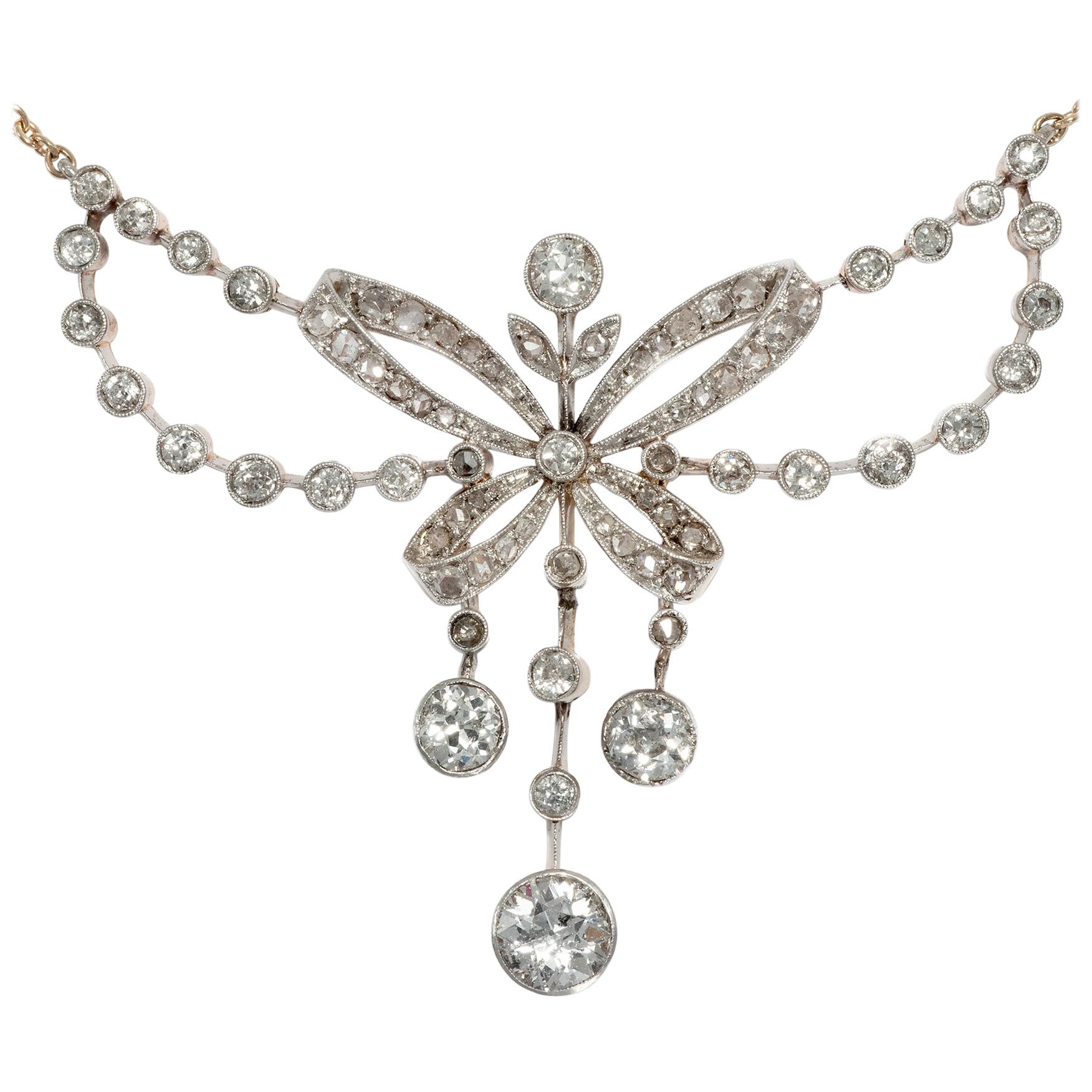 Edwardian circa 1905, 2.49 Carat Diamond Platinum Garland Style Bow Necklace For Sale