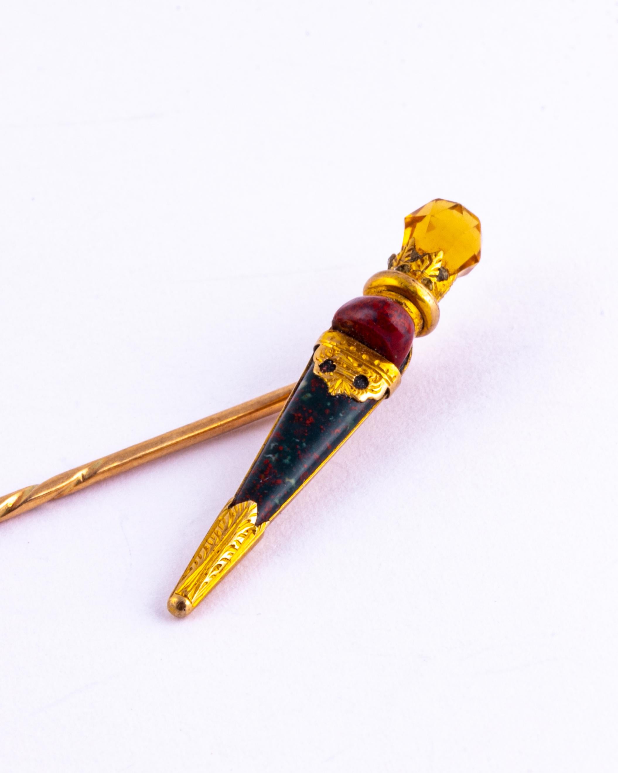 Delicate and beautifully detailed, this dirk pin has a citrine stone at the end and then follows down to a carnelian and bloodstone.   

Total Length: 7cm
Dirk Dimensions: 31x5mm

Weight: 2g