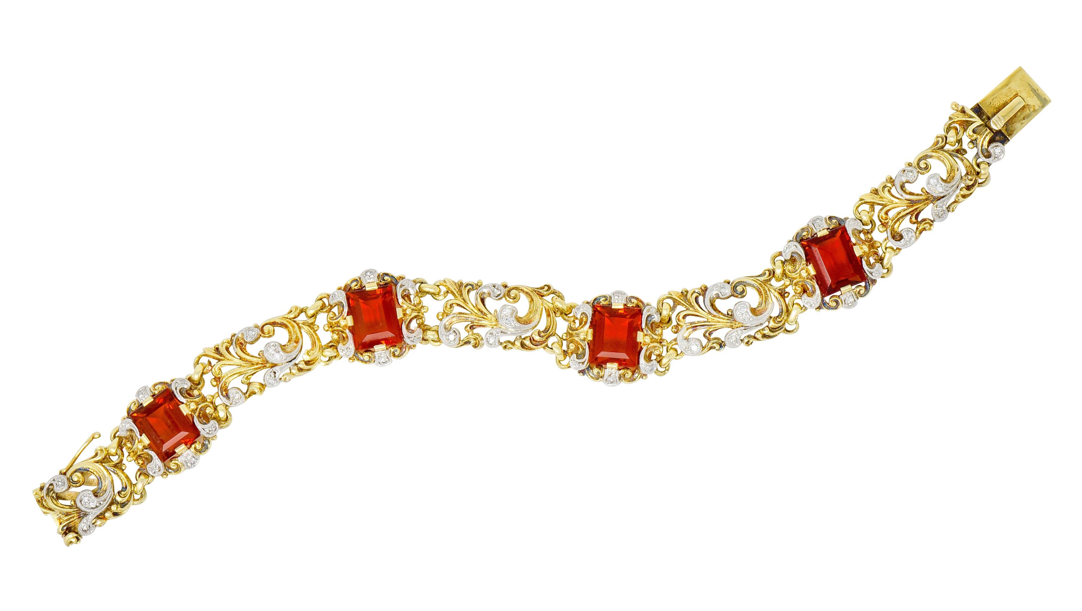 Link style bracelet featuring four emerald cut citrine weighing approximately 10.52 carats, very well-matched with a deep cognac orange color

Set by wide prongs in a pierced and scrolled mounting that alternates with similarly scrolled foliate
