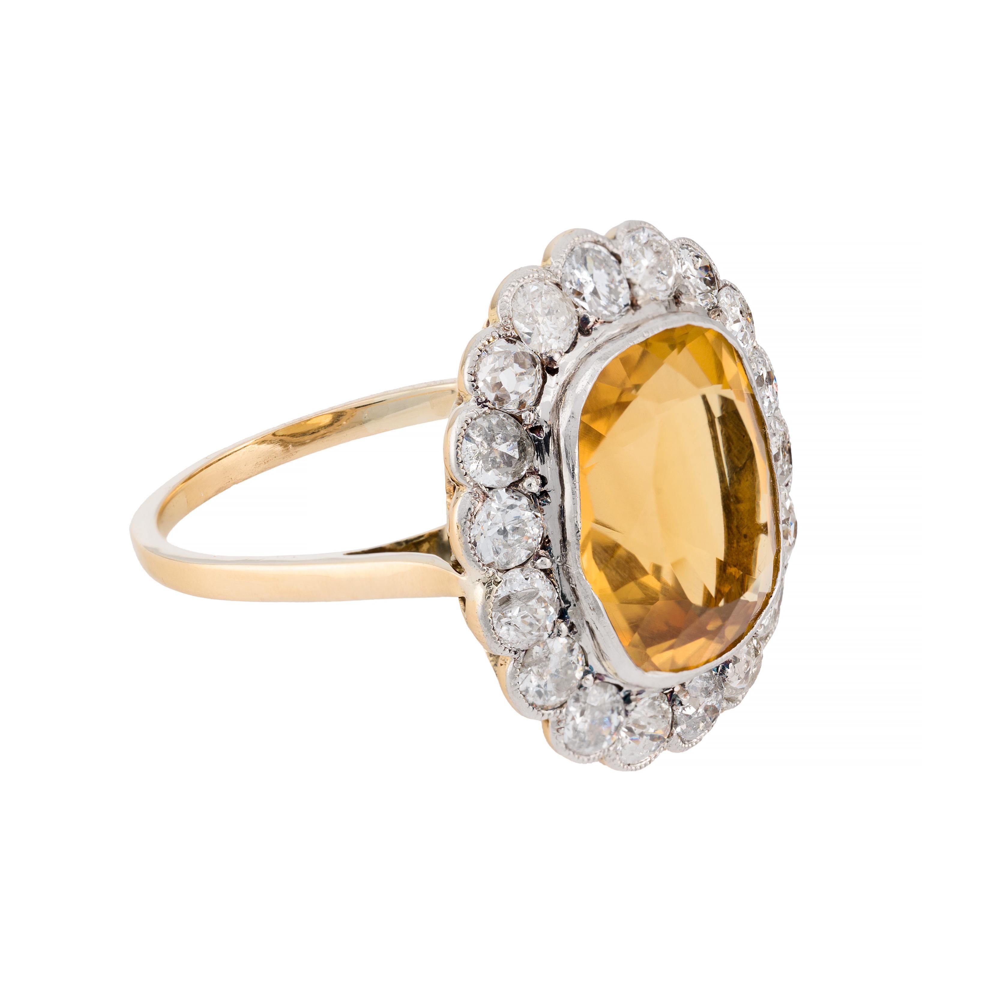 Aston Estate Jewelry Presents:

An exquisite Edwardian ring from 1900. Crafted in a blend of 18k gold and platinum, this piece features a captivating citrine of 9.00 carats as the primary stone, radiating a warm, golden hue.

The citrine is