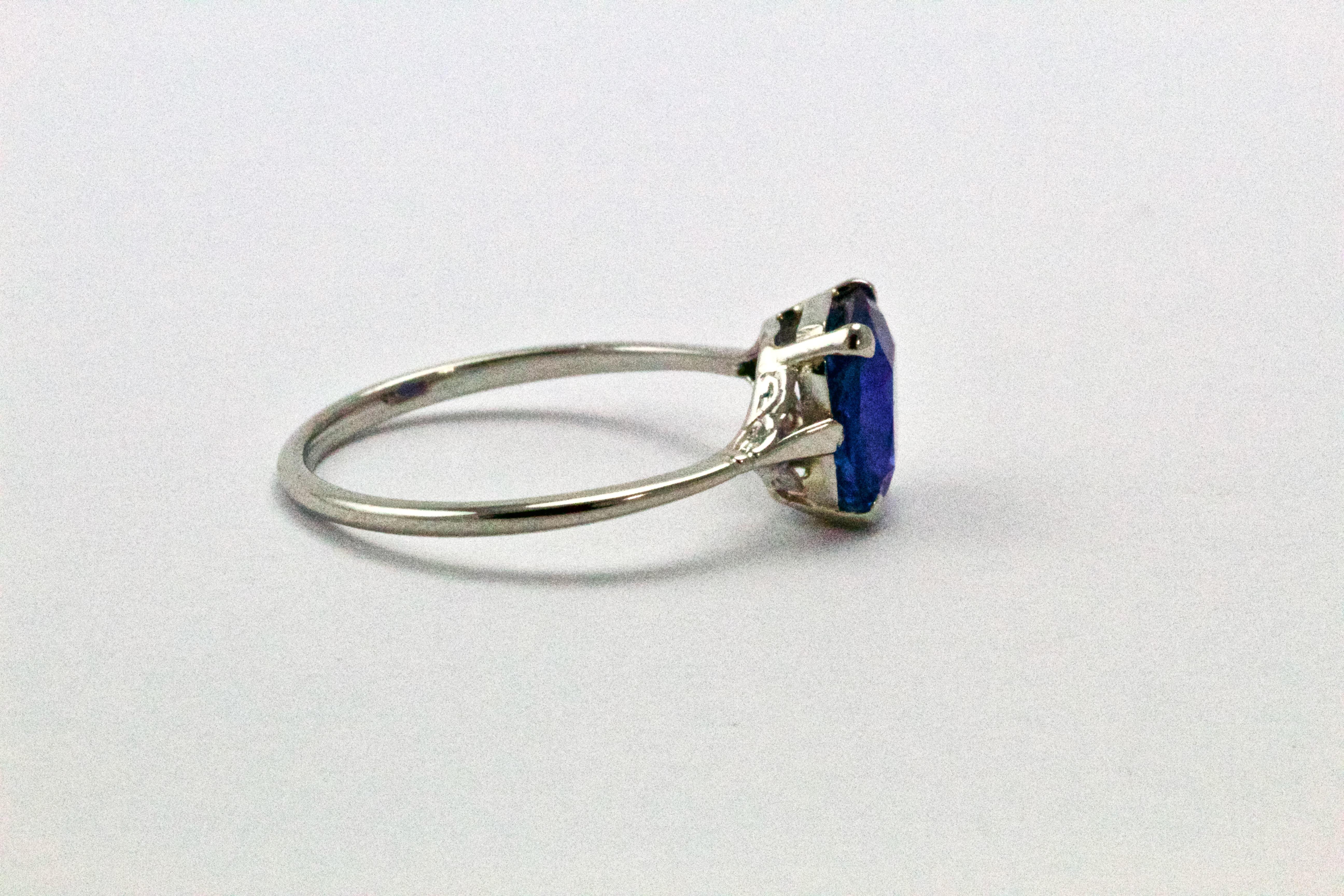 A simply stunning natural cornflower blue sapphire set in a beautiful platinum setting with delicate split shoulders.
1.35 carat stone with stunning powder blue colour and good clarity. 
Ring Size : k 1/2 or 5 1/2
