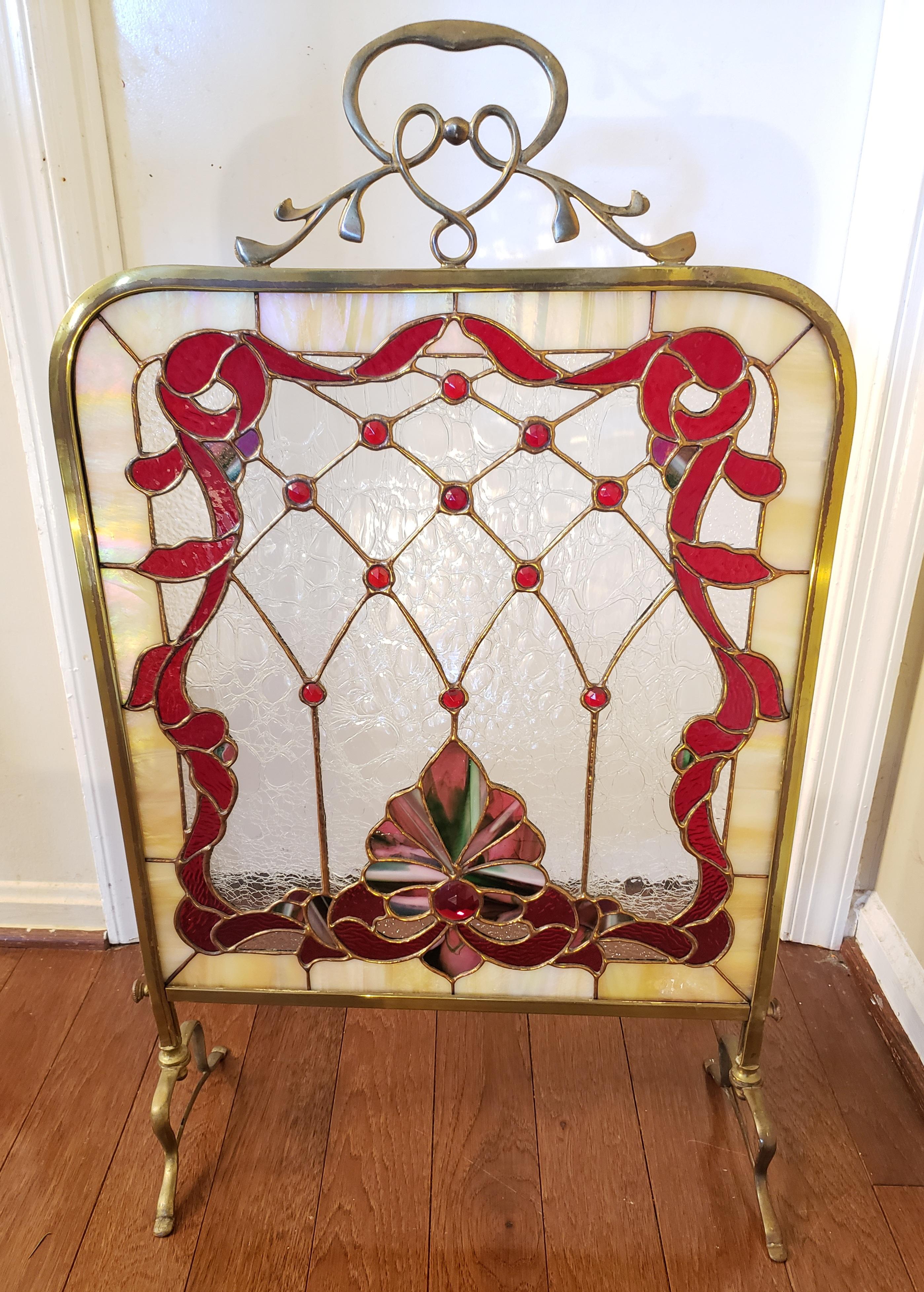 Edwardian period custom made leaded stained glass fire place screen in brass frame.
Great condition. 
Measures 18.75
