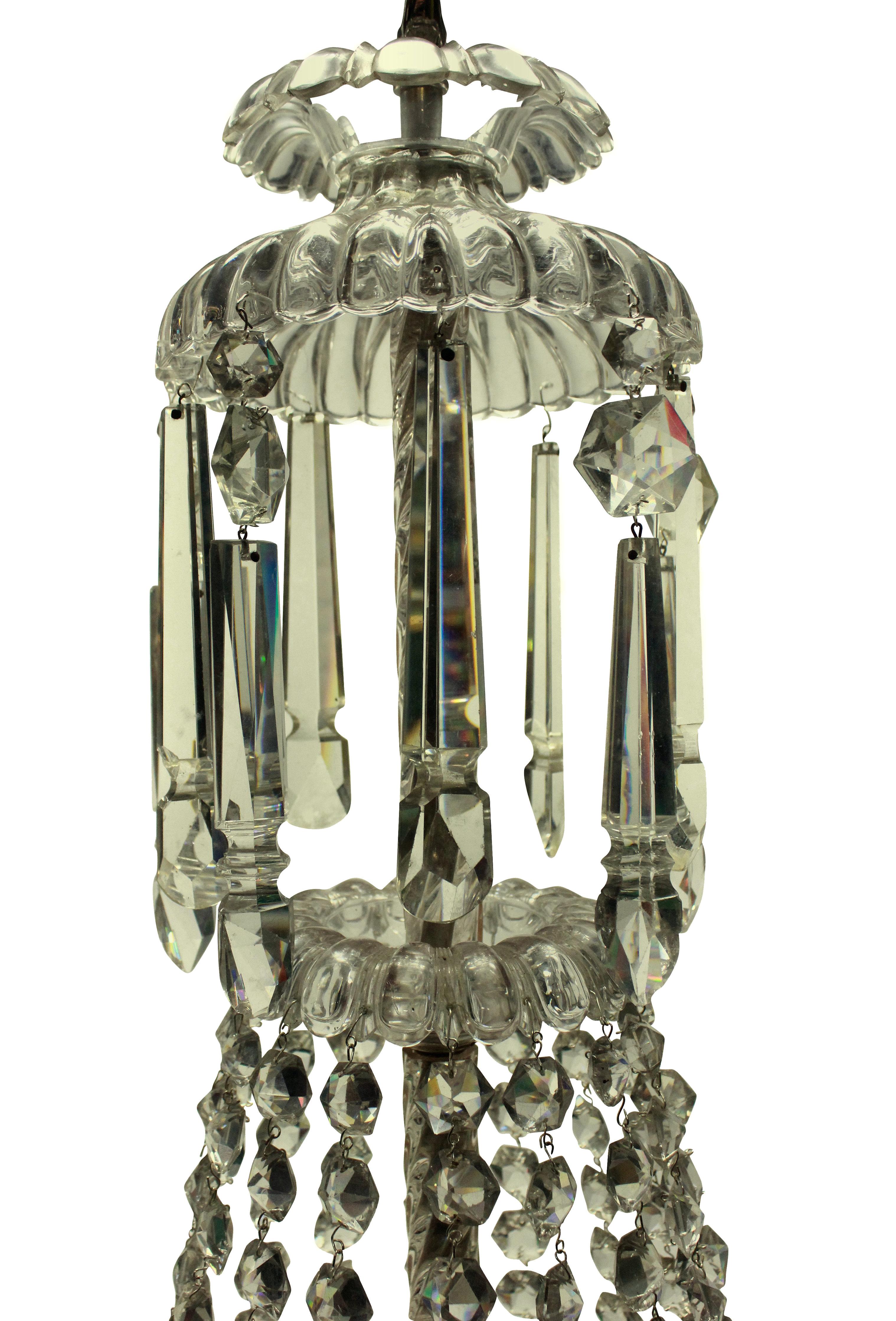 An English Edwardian tent and waterfall chandelier in cut-glass with five internal lights.