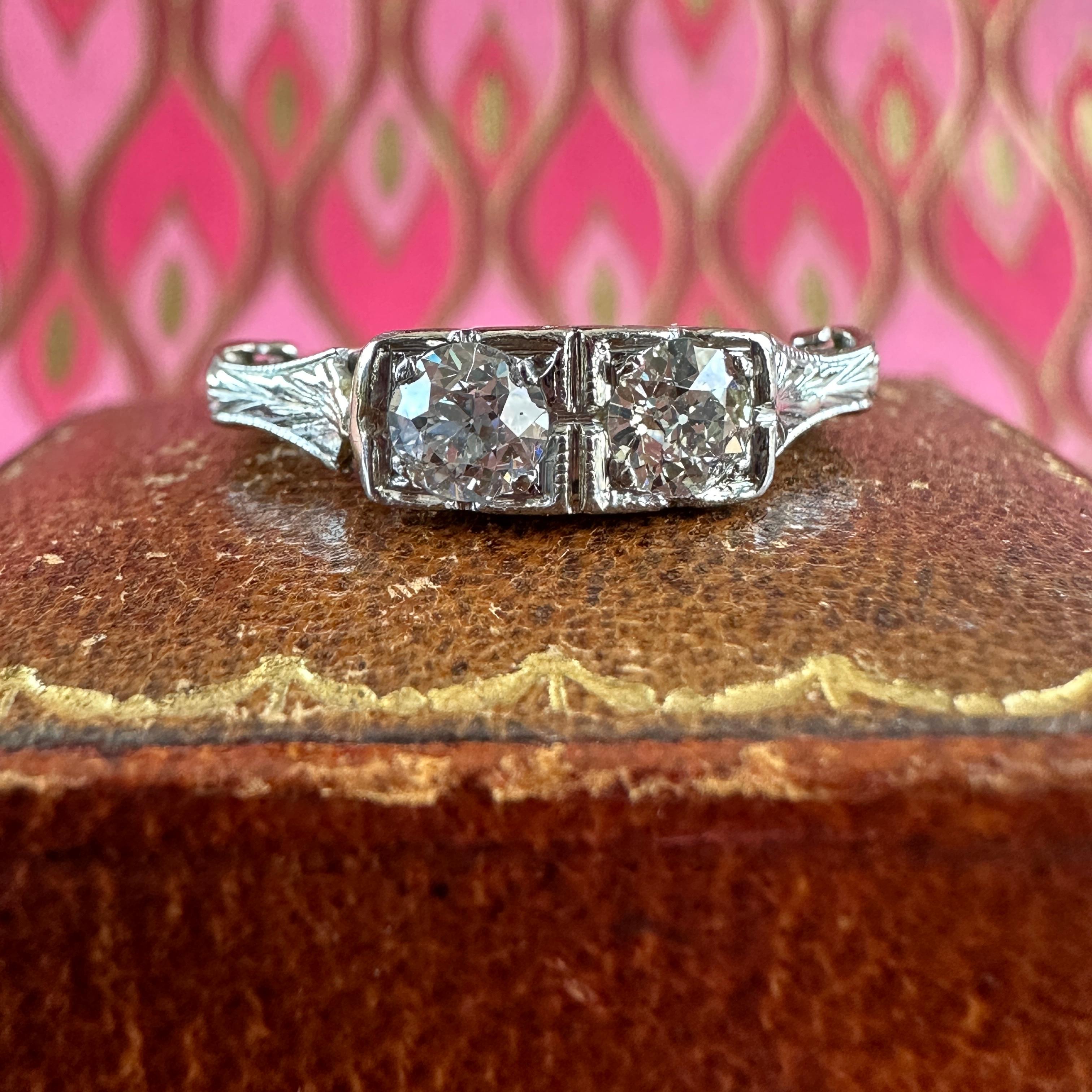 Details: 
Sweet Antique Edwardian diamond, 18K white gold ring. Two diamonds sit side by side in the front, measuring approximately 3.8mm each—roughly .50 total carat weight. It looks great on it's own or paired with an additional band! You'll be