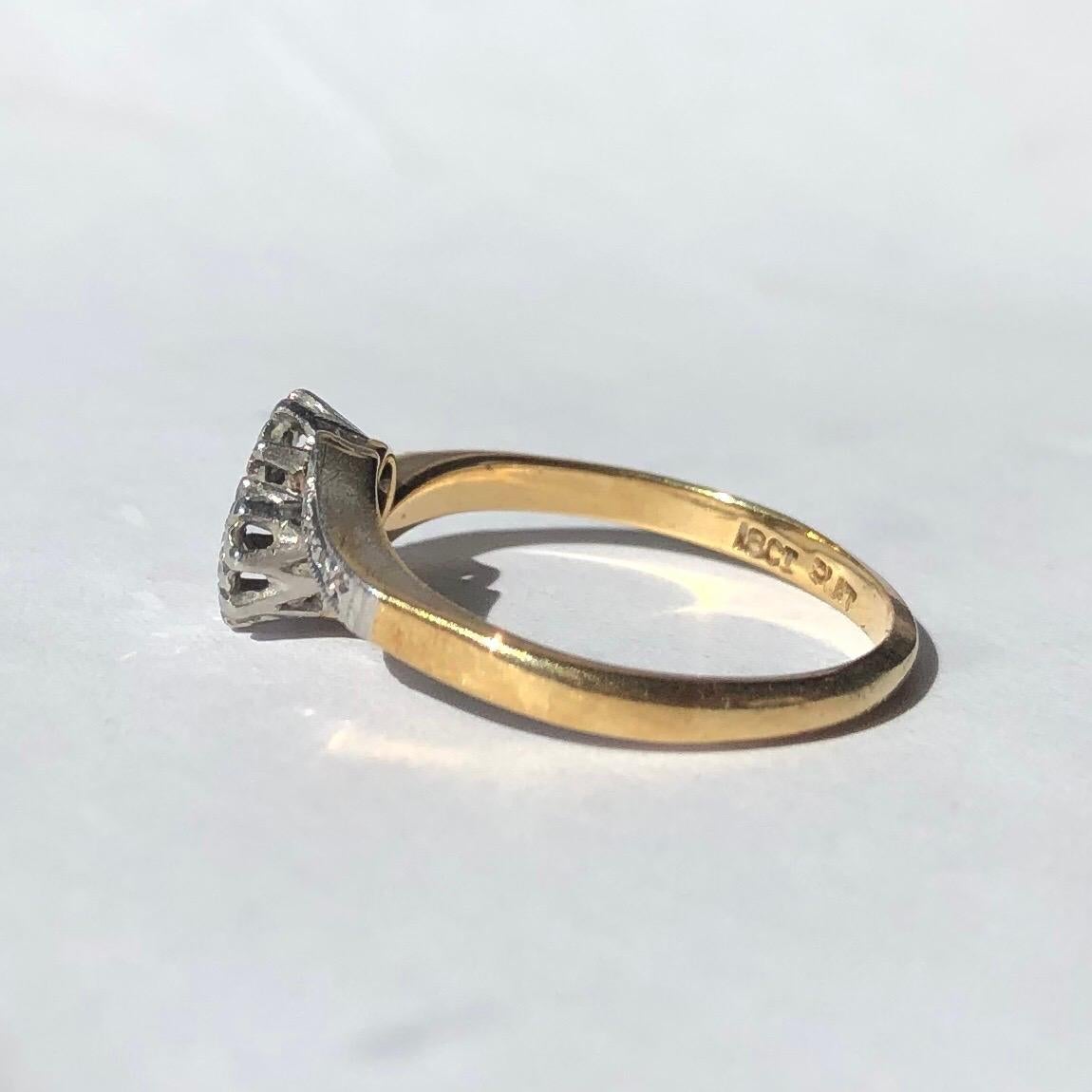 This fancy cross over ring has lots of detail and set within illusion settings are two diamonds. The diamonds total 10pts. The stones are set in platinum and the ring is modelled in 18ct gold. 

Ring Size: N or 6 3/4
Height Off Finger: 4mm
Widest