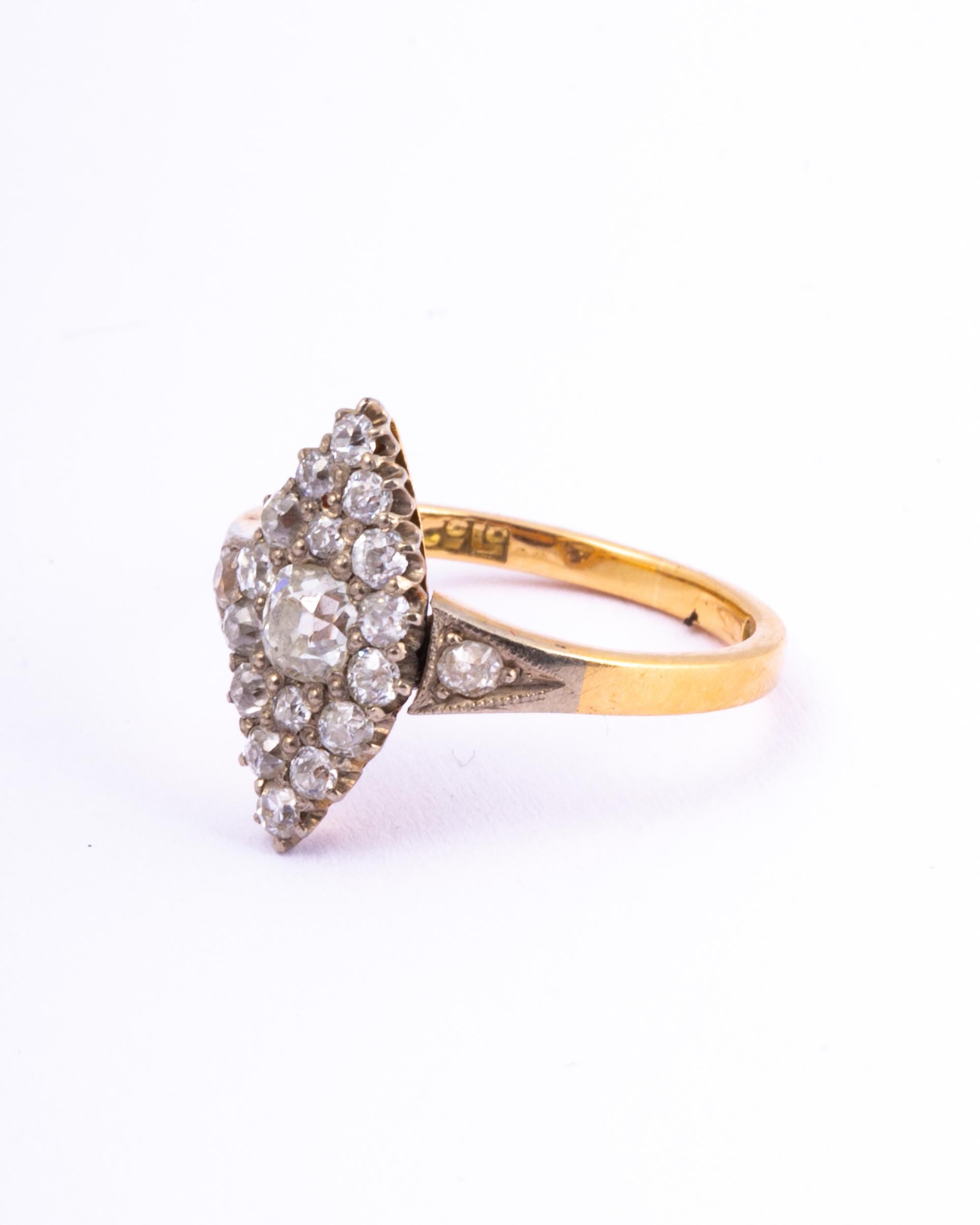 The diamond in this marquise ring are old Mine cut and are very bright and sparkly. The total carat weight of the ring is approx 1ct. The stones are set in platinum and the rest of the ring is modelled in 18ct gold with diamond shoulders. 

Ring