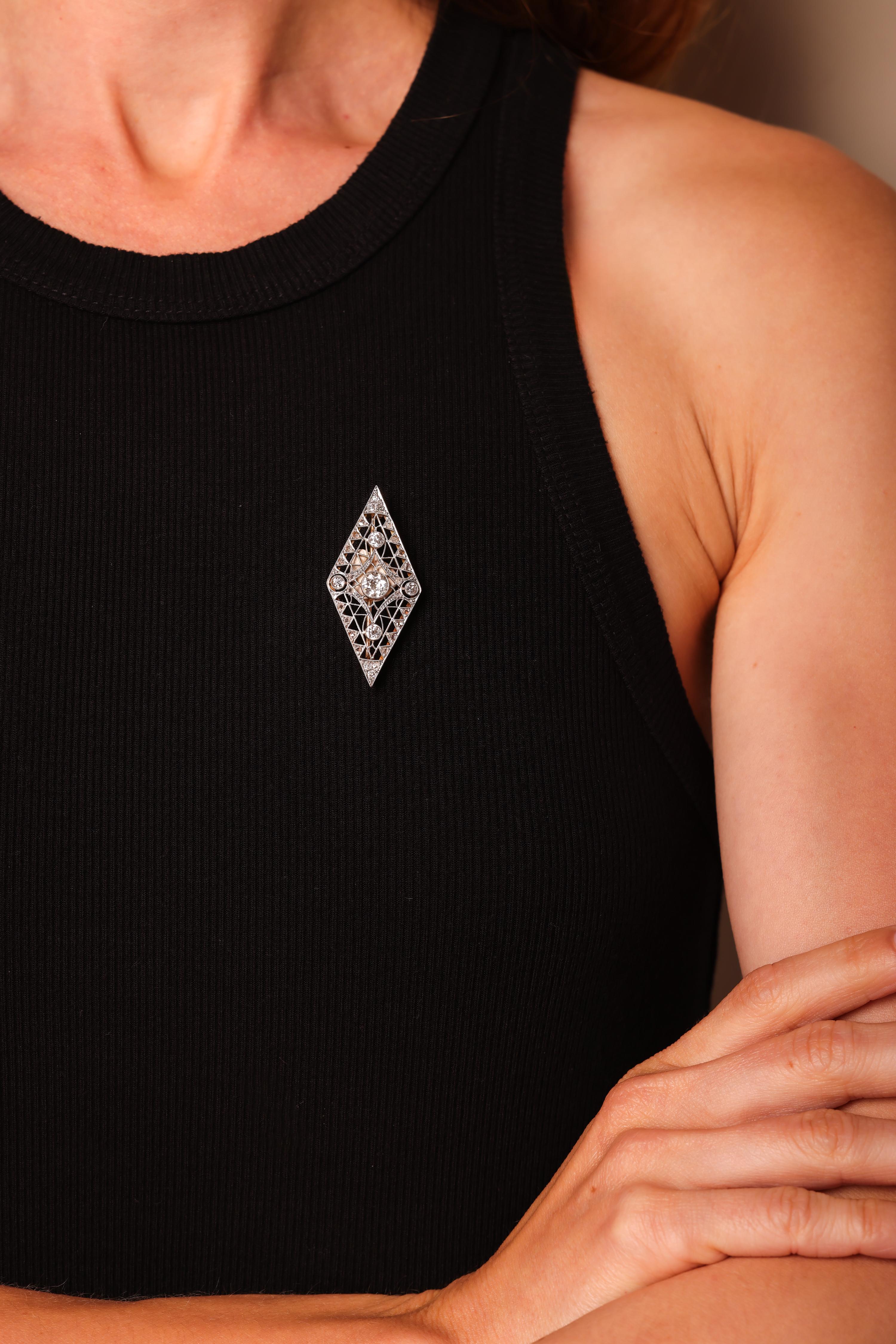 Center Stone: 5 Diamonds
Cut: Old European and Old Mine Cuts
Weight: Approximately 1.6 Carats
Color: J
Clarity: SI
Accent Stone: 26 Diamonds
Cut: Old Mine and Rose Cuts
Weight: Approximately .70 Carats
Color: J
Clarity: SI
Metal: 18K Yellow Gold and