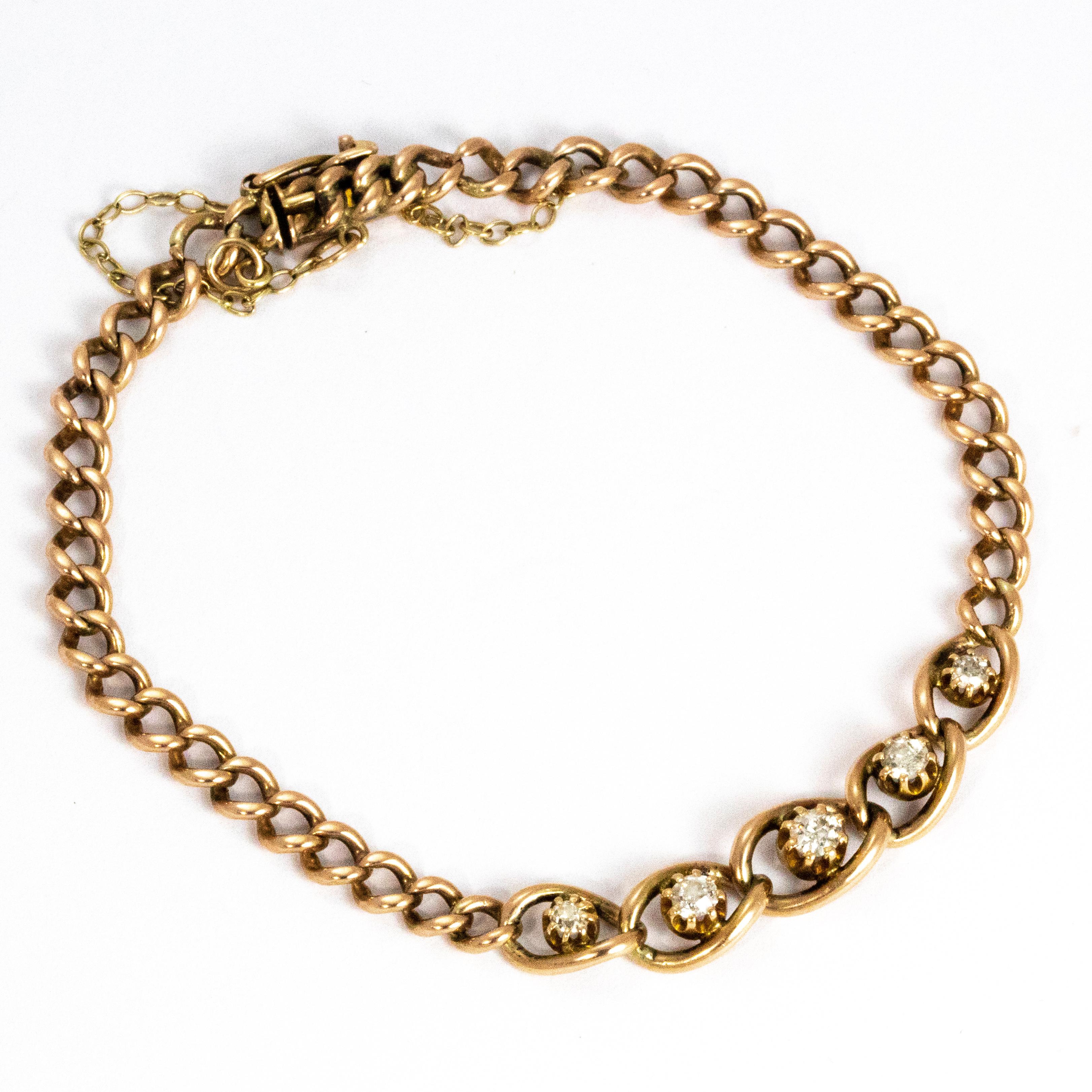 This delicately beautiful Edwardian bracelet holds five sparkling diamonds encased in larger links. The bracelet is made up of a 9ct curb link chain.

Length: 7inches 