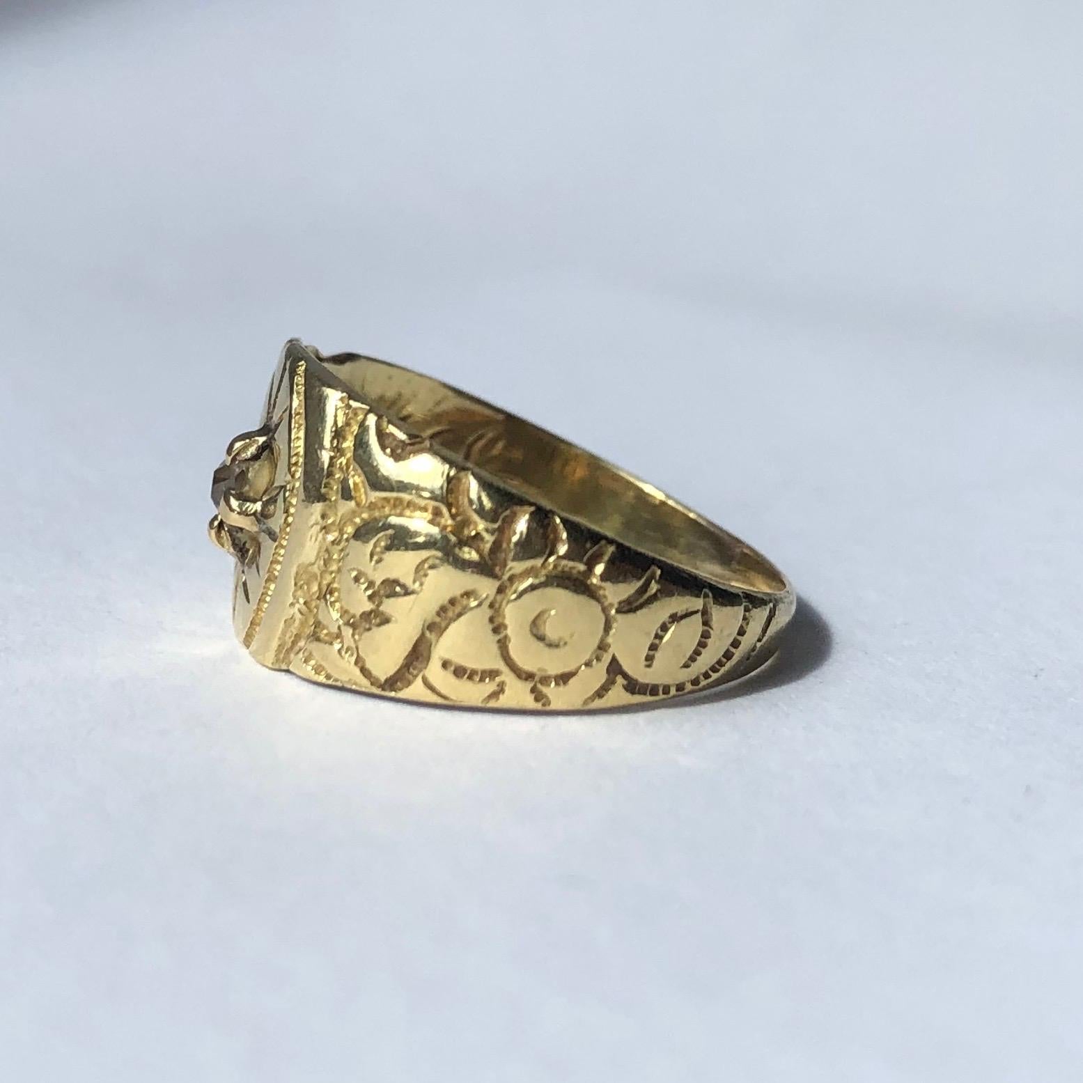 This gorgeous extra wide 18carat gold band has deep engraving on the shoulders and detail around the diamond at the centre. The diamond is sat proud in a claw setting and measures approx 5pts. There is engraving on the inside reading 'W.E.P to