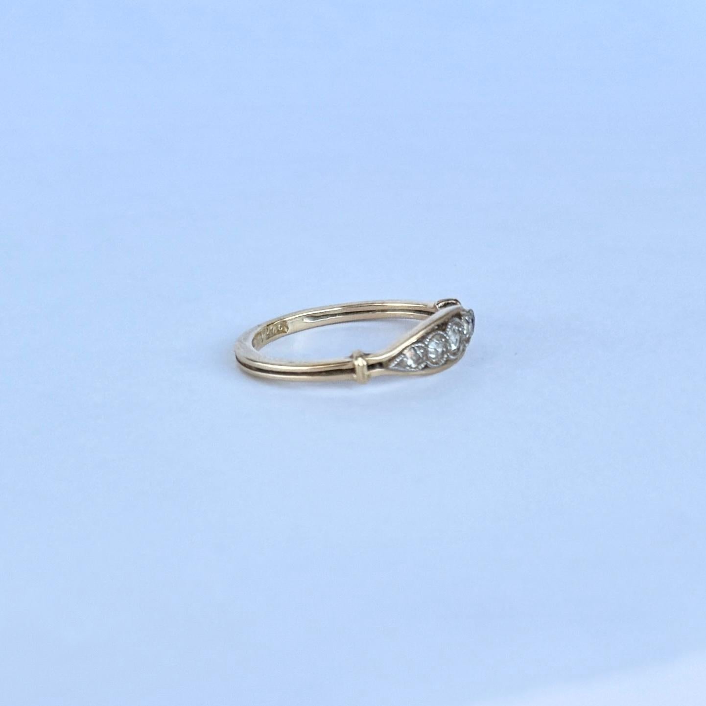 Set in this 18carat gold band are five sparkling diamonds. The central diamond measures 5pts and the smaller diamonds measure 3pts and 2pts. 

Ring Size: K or 5 1/4
Band Width: 5mm 

Weight: 1.8g