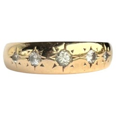 Edwardian Diamond and 18 Carat Gold five-Stone Star Setting Band
