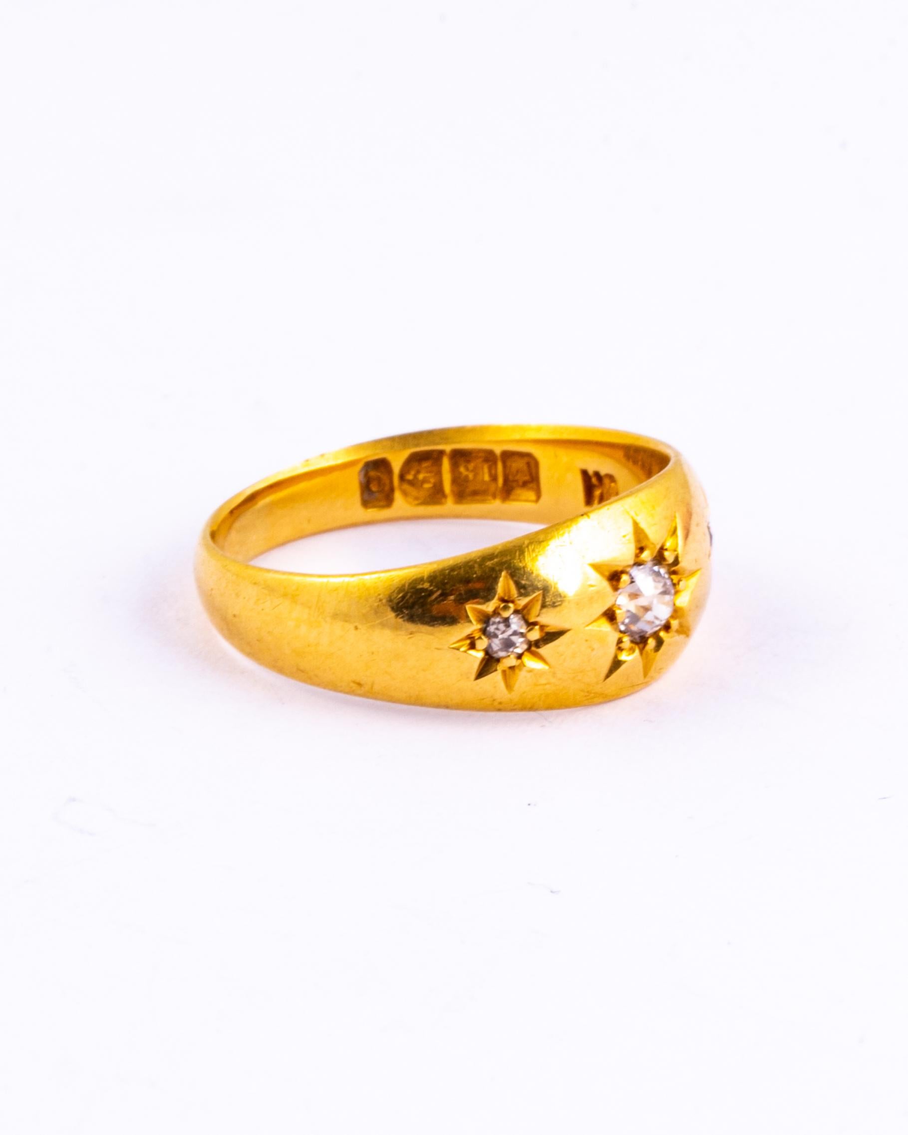 This gypsy ring holds three diamonds totalling approx 30pts and these are set in star settings. The glossy gold band is modelled in 18ct gold and made in Chester, England.

Ring Size: N or 6 3/4 
Band Width: 8mm

Weight: 4.58g