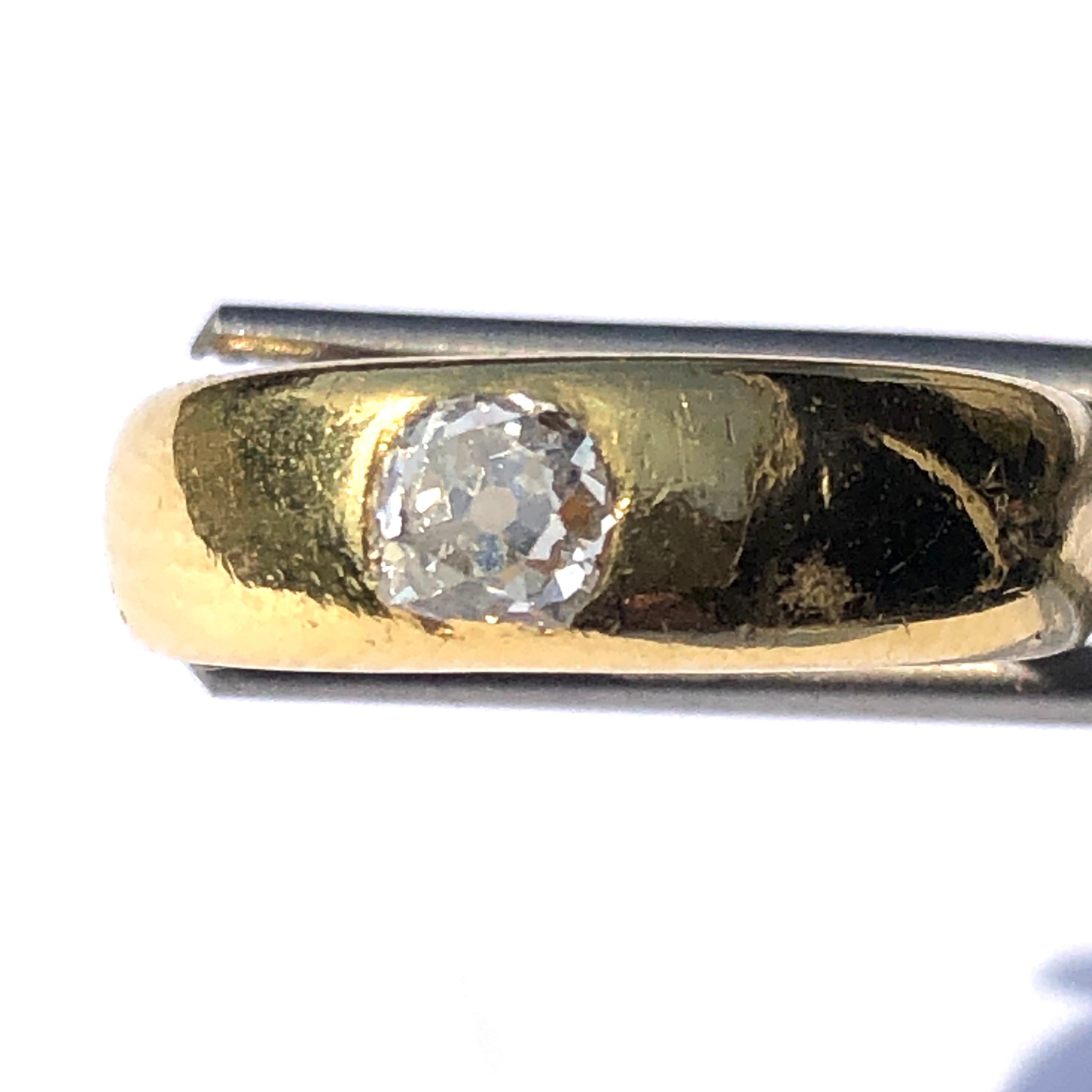 The old mine cut diamond that sits within this gorgeous glossy gold band is old mine cut, H/I colour and measures 45pts. The simple style of this band is very wearable and the diamond adds a little sparkle and glam to the ring. 

Ring Size: J or