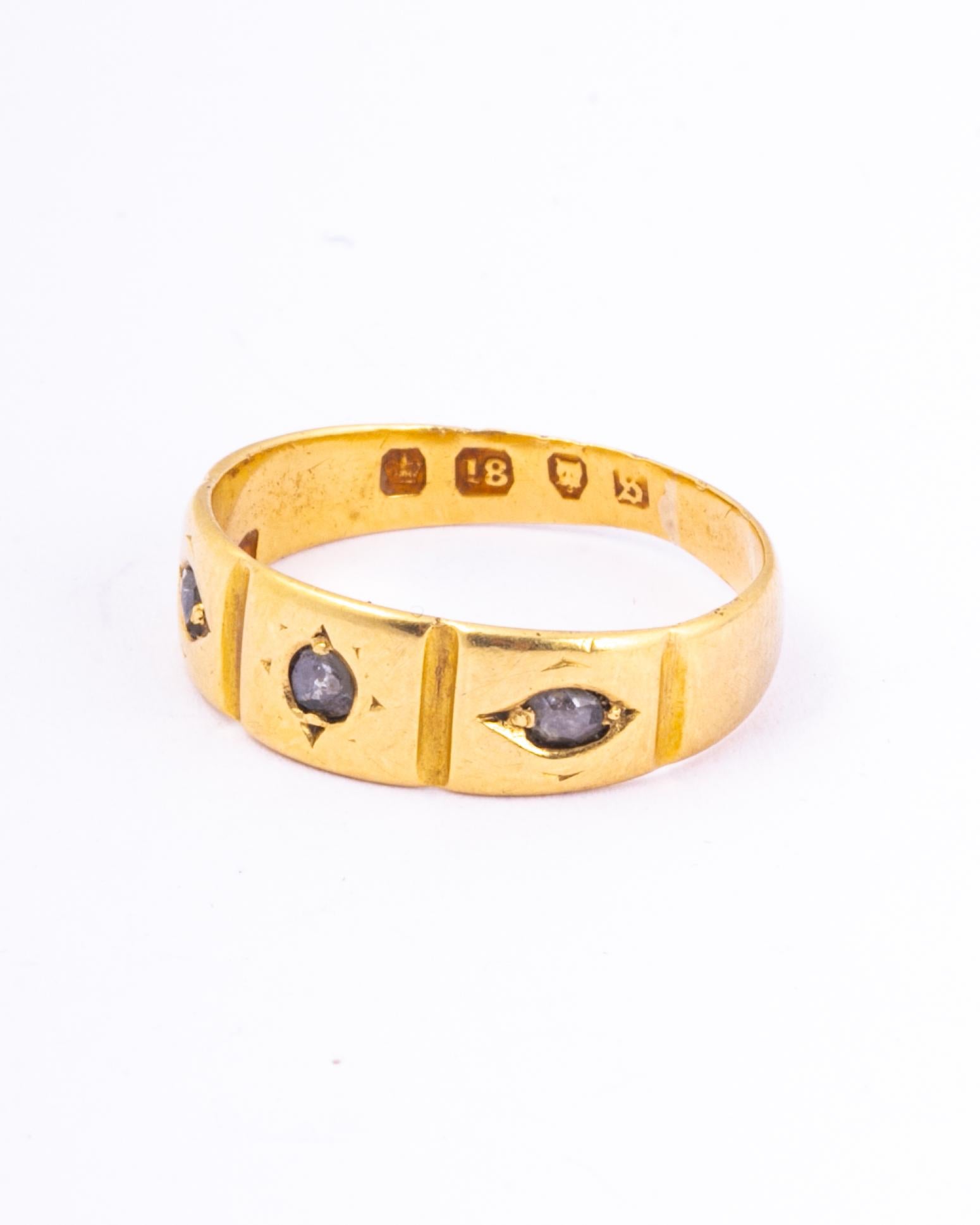 The simple design of this wide gold band is glitzed up by four lovely sized rose cut diamonds. The diamonds are set in square settings and they sit within the 18ct gold. Made in London, England. 

Ring Size: J or 4 3/4 
Band Width: 5.5mm 

Weight: