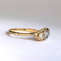 Edwardian Diamond and 18 Carat Gold Three-Stone Cross Over Ring