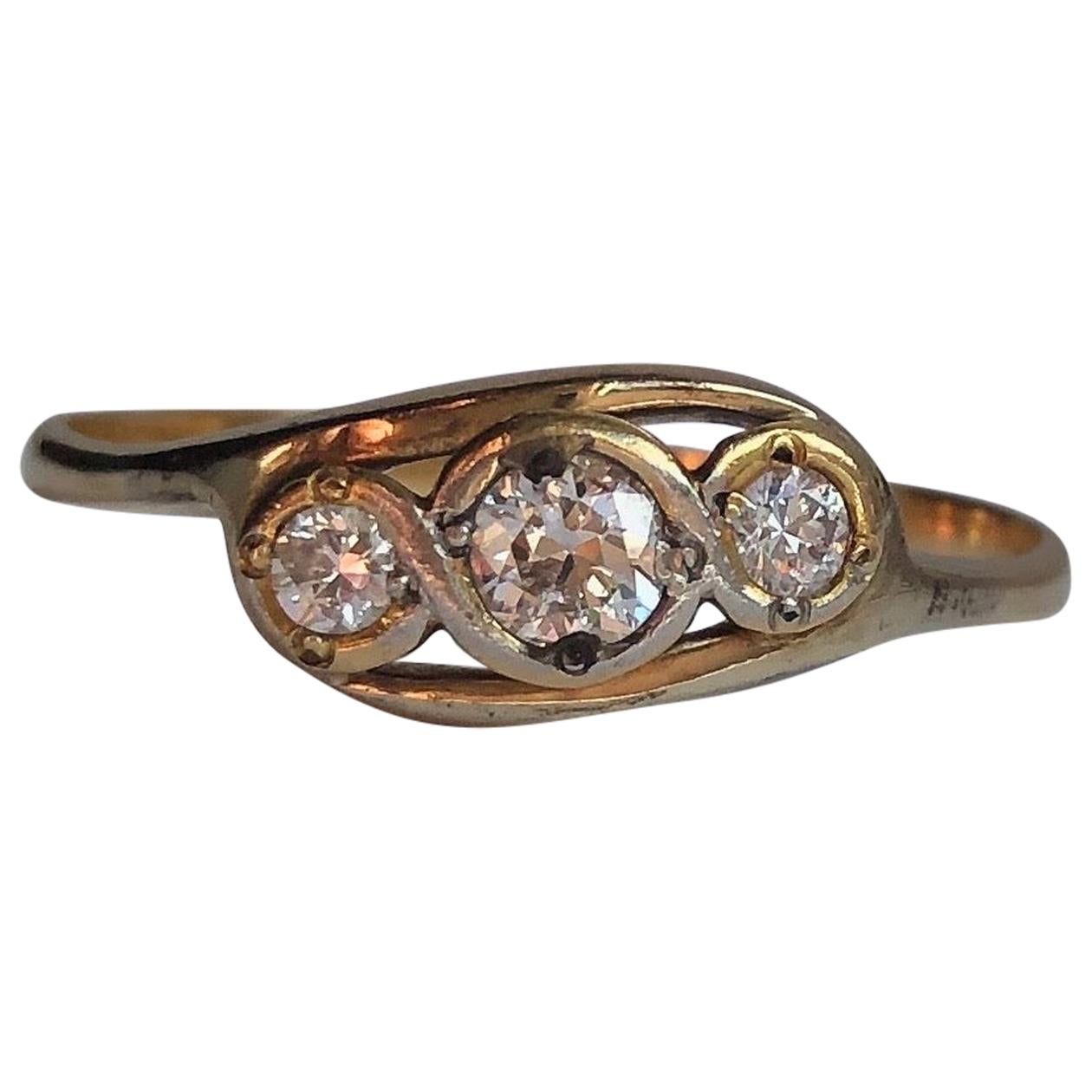 Edwardian Diamond and 18 Carat Gold Three-Stone Cross Over Ring