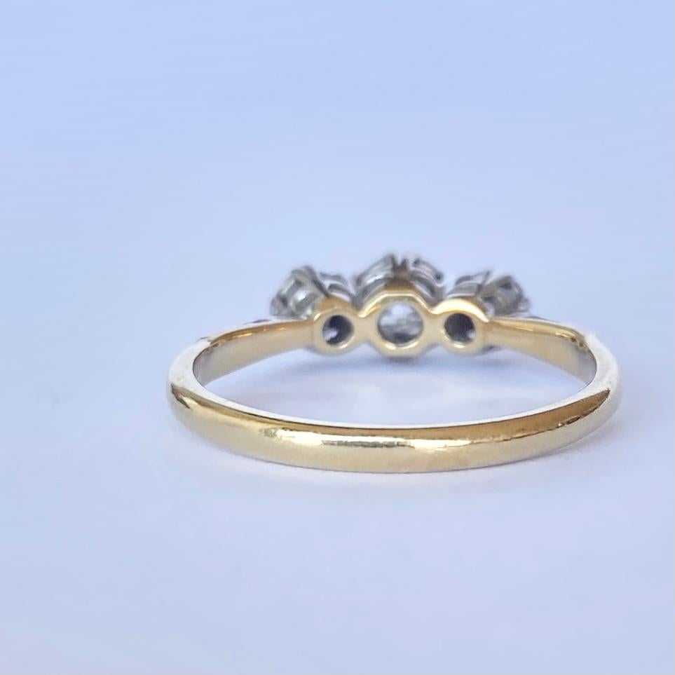 The diamonds in this ring total 40pts and are bright and sparkly. They are encased in platinum upon an 18carat gold band. 

Ring Size: M 1/2 or 6 1/2 
Height Off Finger: 5mm

Weight: 2.5g