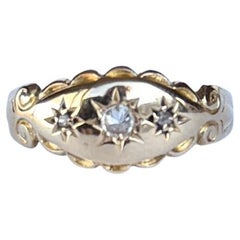 Edwardian Diamond and 18 Carat Gold Three Stone Star Setting Band