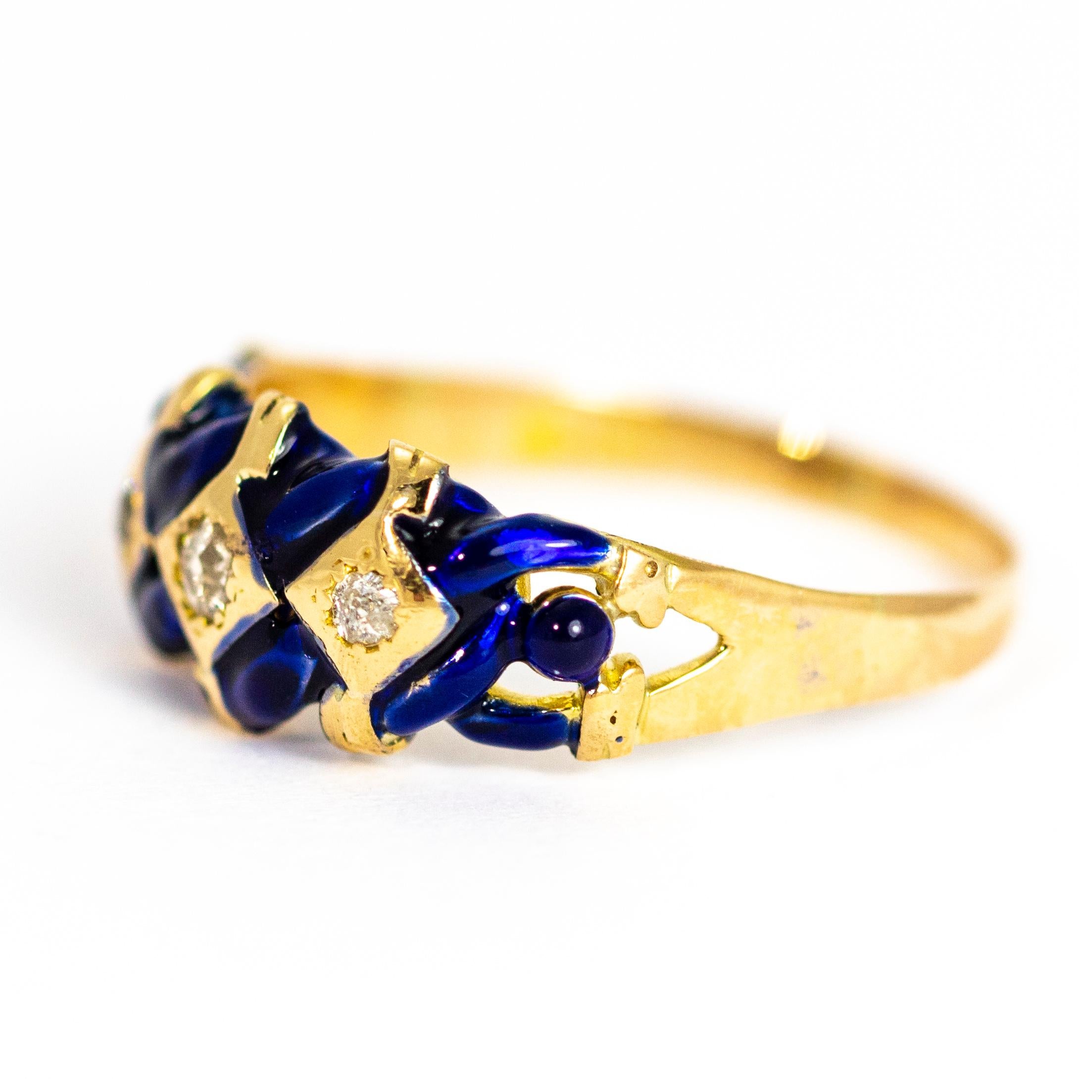The three old European cut diamonds in this ring sparkle in gold square settings which has deep blue enamel woven around the gold. Modelled in 15ct gold and made in Chester, England.

Ring Size: R 1/2 or 9
Band Width: 8.5mm