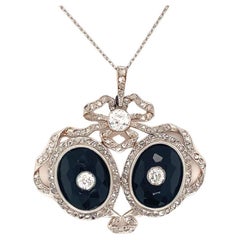 Pendentif édouardien en platine et or jaune 18 carats orné de diamants et d'onyx, vers 1900