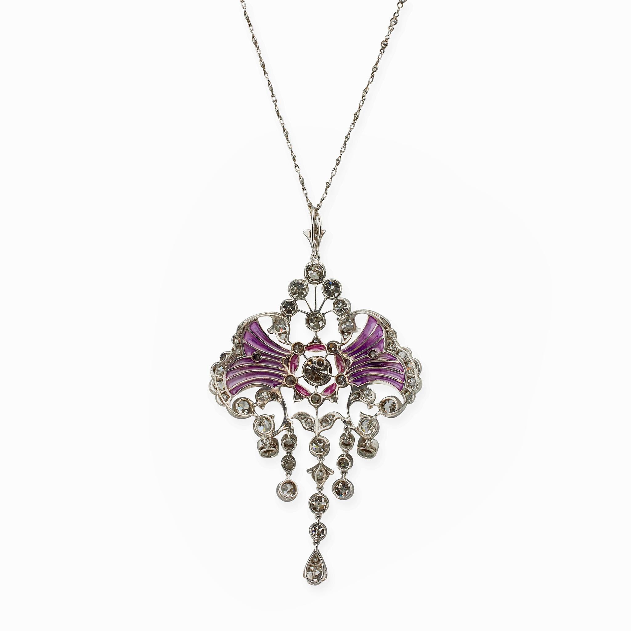 Created around 1910, this Edwardian pendant necklace is composed of diamonds, plique-à-jour enamel and platinum. The scrolling floral and foliate motif pendant is composed of old European and old mine-cut diamonds enhanced by panels of lilac and