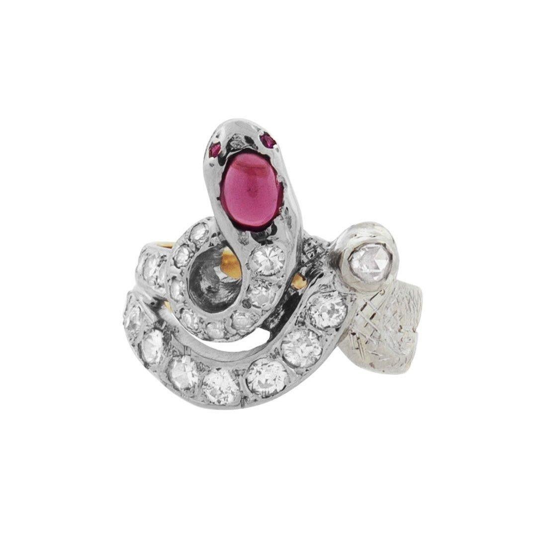 A magnificent diamond and ruby snake ring from the Edwardian (ca1910) era! Crafted in 14kt yellow gold topped with platinum, this fabulous piece portrays a single snake, whose body and tail coils around the finger to form a dramatic and bold ring.