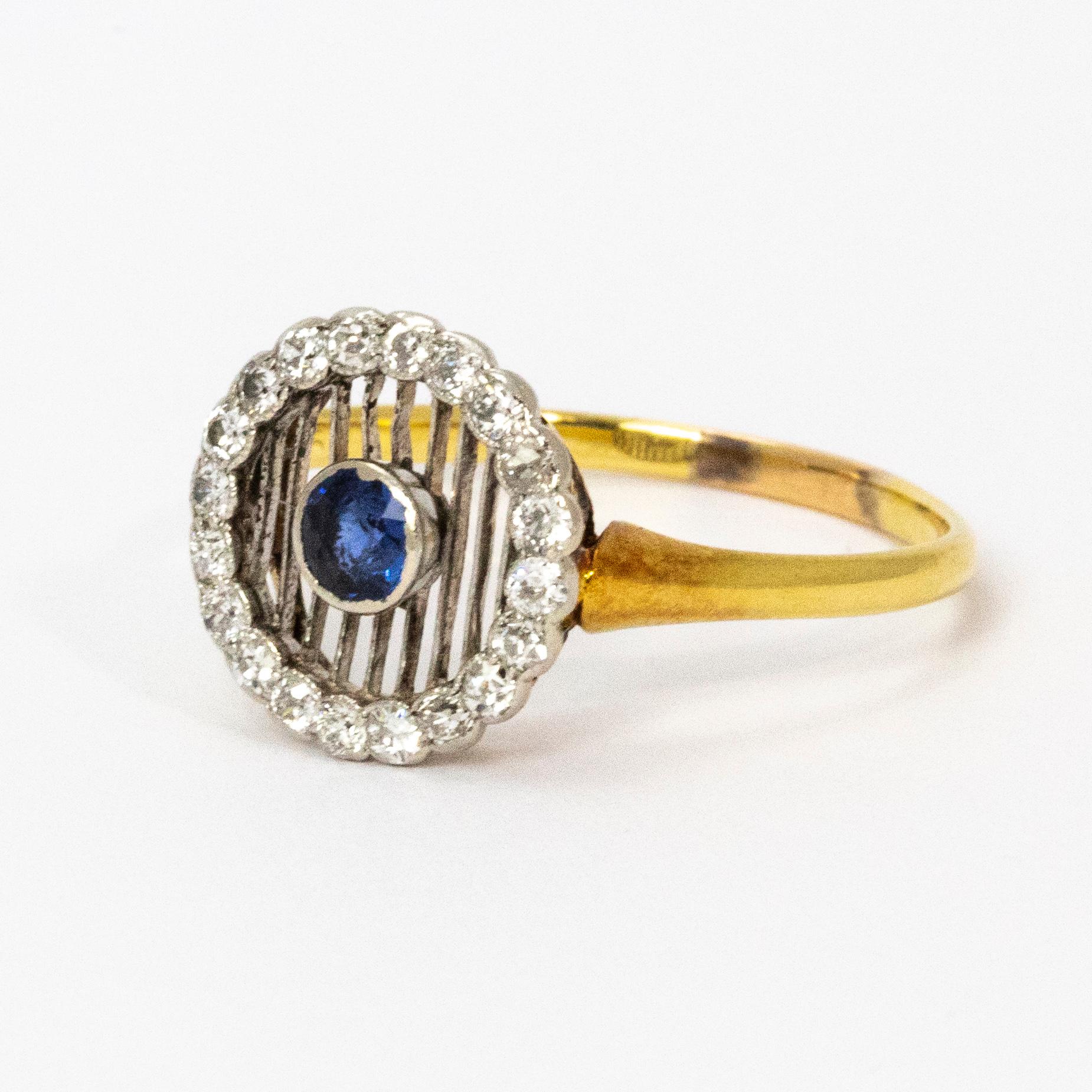 Unusual and striking Edwardian ring. The central sapphire is set within delicate open worked platinum and then surrounded by a halo of diamonds and finished with an 18ct gold band.

Ring Size: S 1/2 or 9 1/4