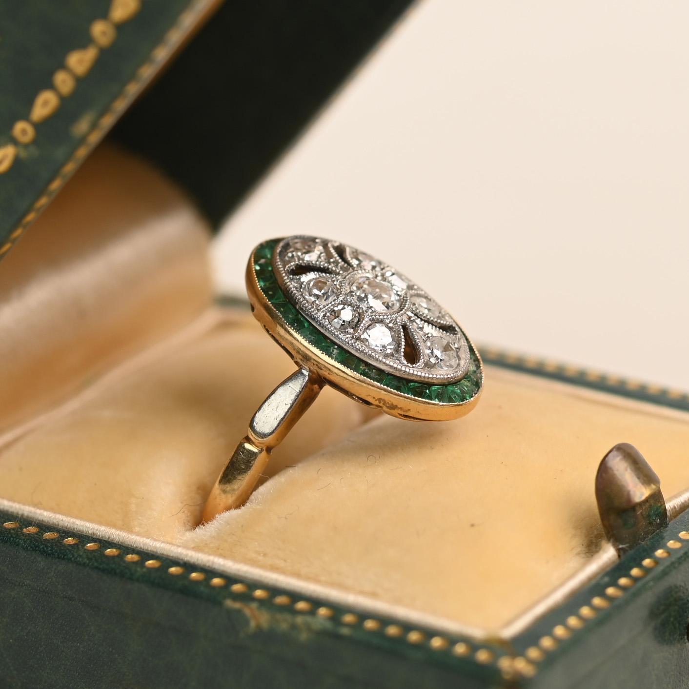 This French Edwardian era ring, crafted circa 1910, showcases a graceful elongated filigree design richly adorned with diamonds and fine milgrain detailing. The delicate latticework is set with diamonds totaling approximately 0.20 carats, creating a