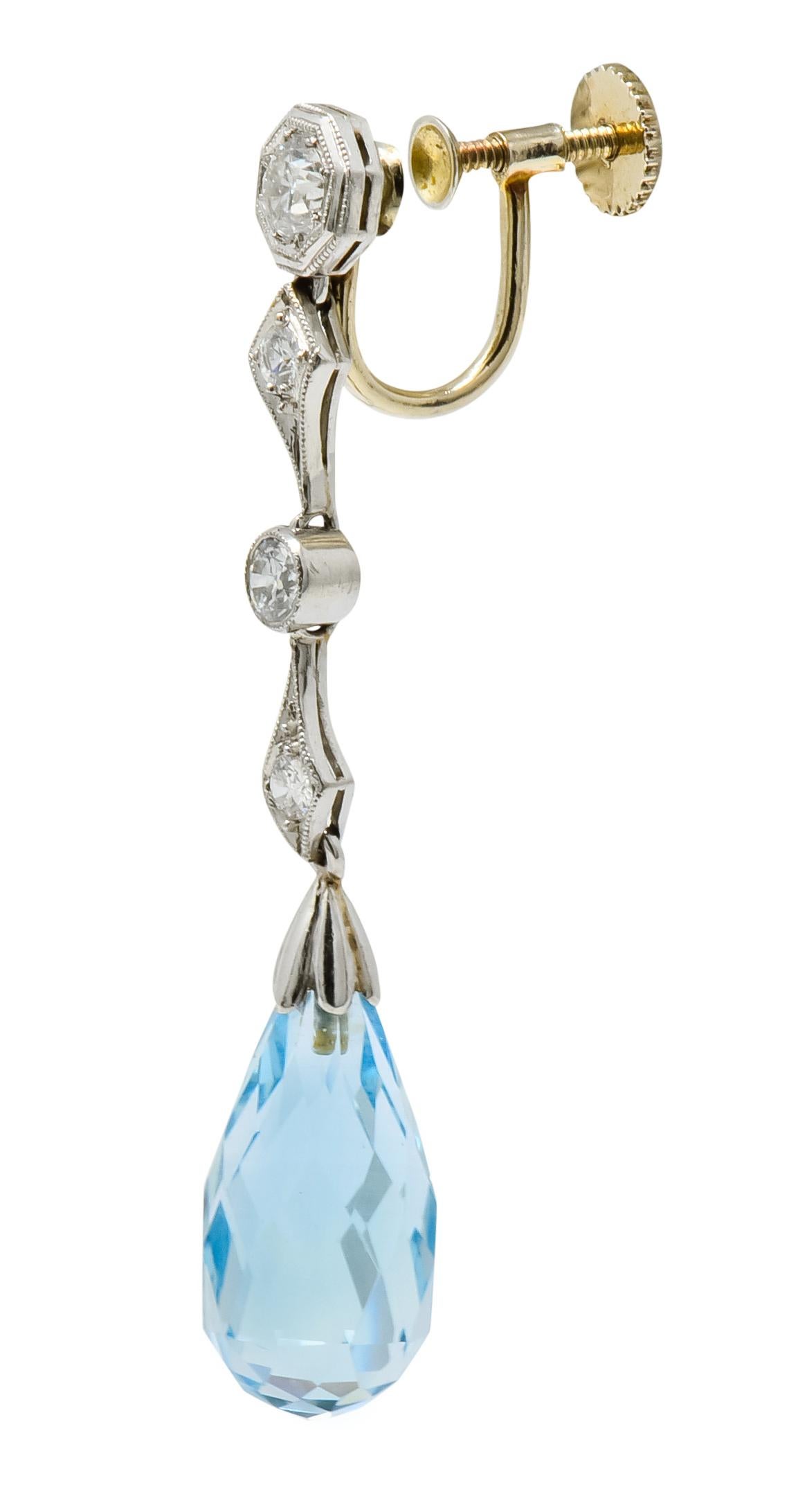 Each earring designed with four geometric platinum links, bead set with old European cut diamonds weighing approximately 0.70 carat total; H/I color and VS clarity

With milgrain detail and articulation, links suspend a briolette cut aquamarine