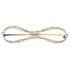 Edwardian Diamond Bow Brooch in Platinum and 18 Karat Yellow Gold