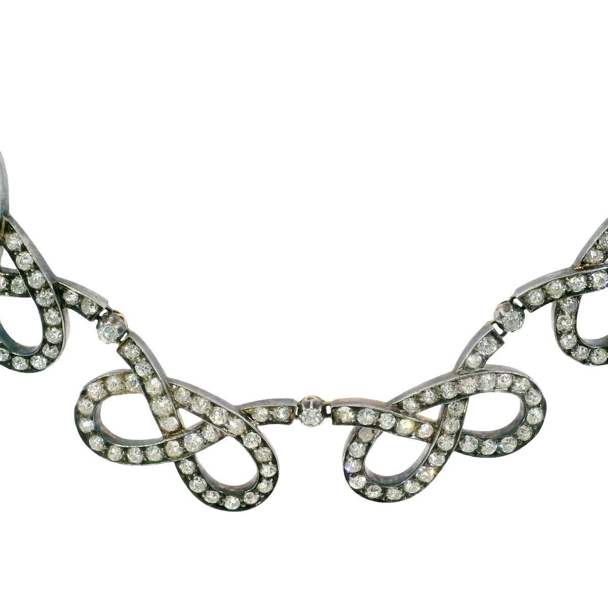 Edwardian Diamond Choker Necklace Silver Topped Gold Infinity Link ~31.9ctw

This exceptional Edwardian link necklace, crafted circa 1900, is not only a stunning example of fine jewelry but also a tangible piece of history. Over a century old, it