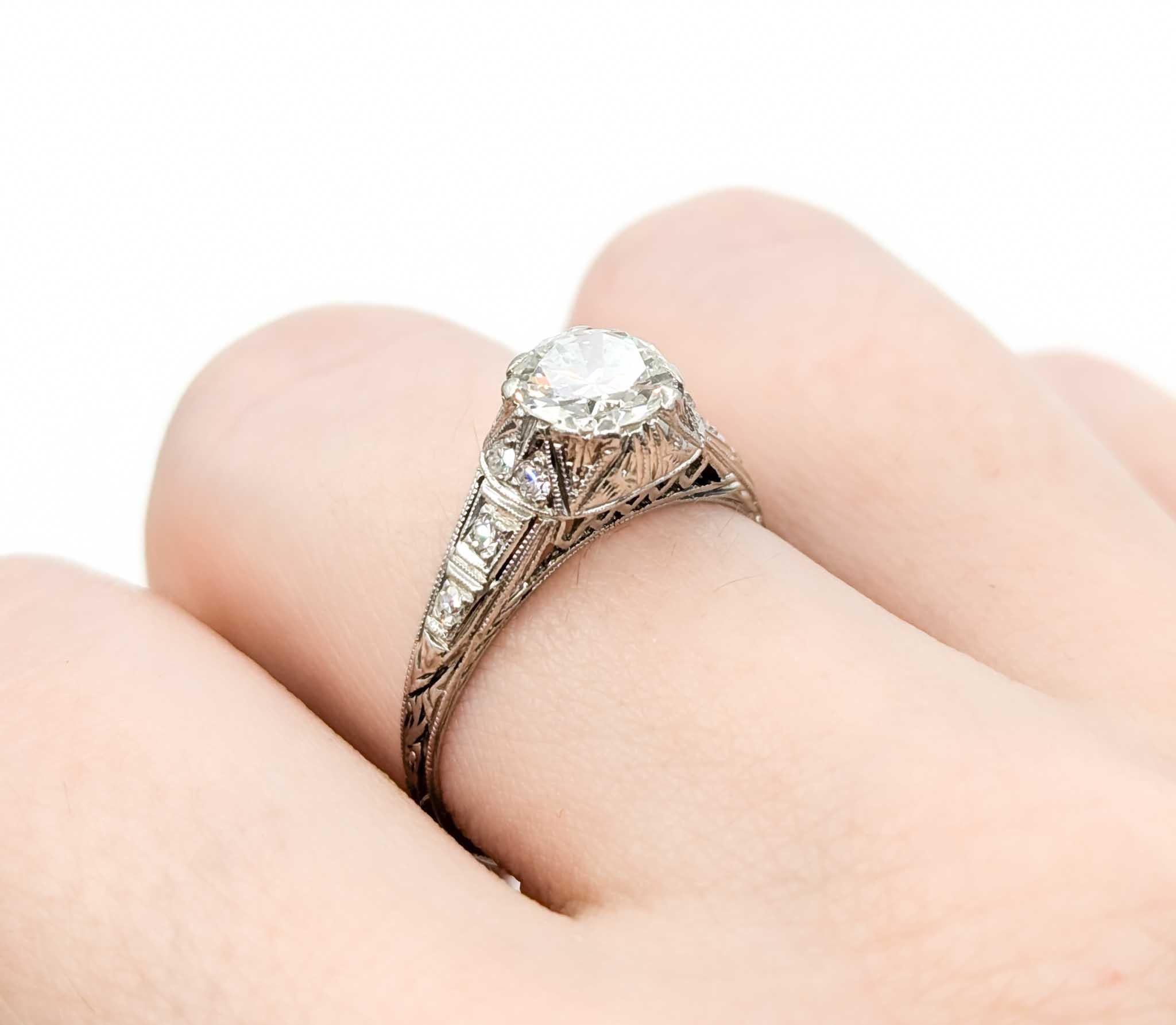 Edwardian Diamond Engagement Ring in Platinum

Introducing this beautiful antique ring, crafted in platinum. The ring features a .90ct old European diamond centerpiece with .12ctw diamonds and Edwardian gems, creating a sophisticated and timeless