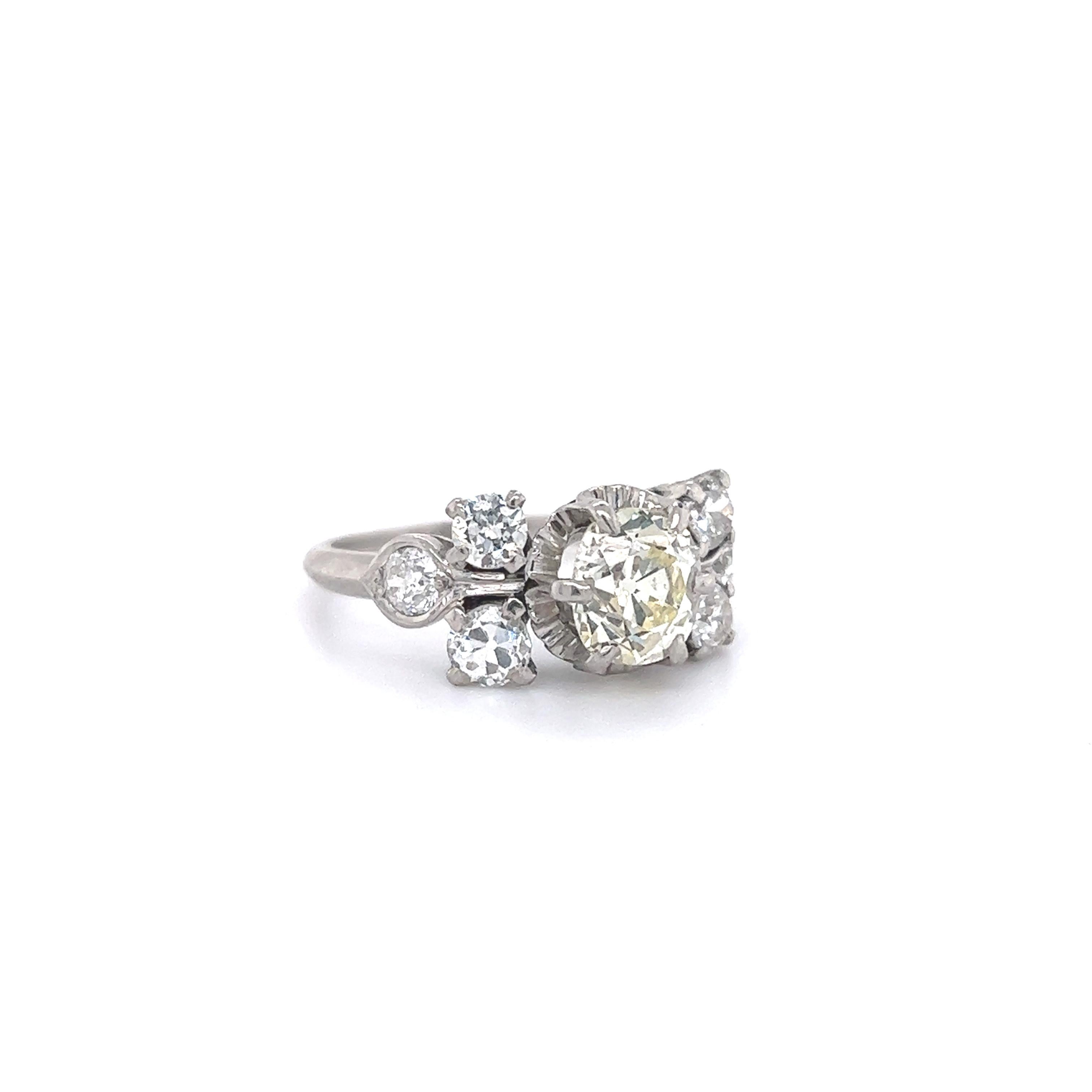 Beautiful hand crafted platinum ring. The ring is from the Edwardian era and is as breathtaking today as it was 120 years ago! The ring is highlighted with one vintage cushion mined brilliant center diamond. The diamond in the design weighs