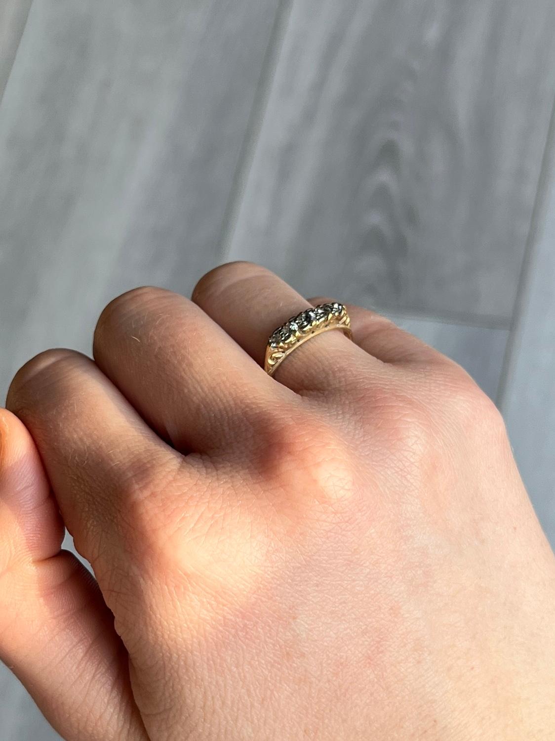 Five bright glistening diamonds sit fabulously on top of a simple open work setting modelled in 18ct gold. The diamonds total 30pts. 

Ring Size: K or 5 1/4
Face Width: 4mm
Height Off Finger: 3.5mm

Weight: 2g