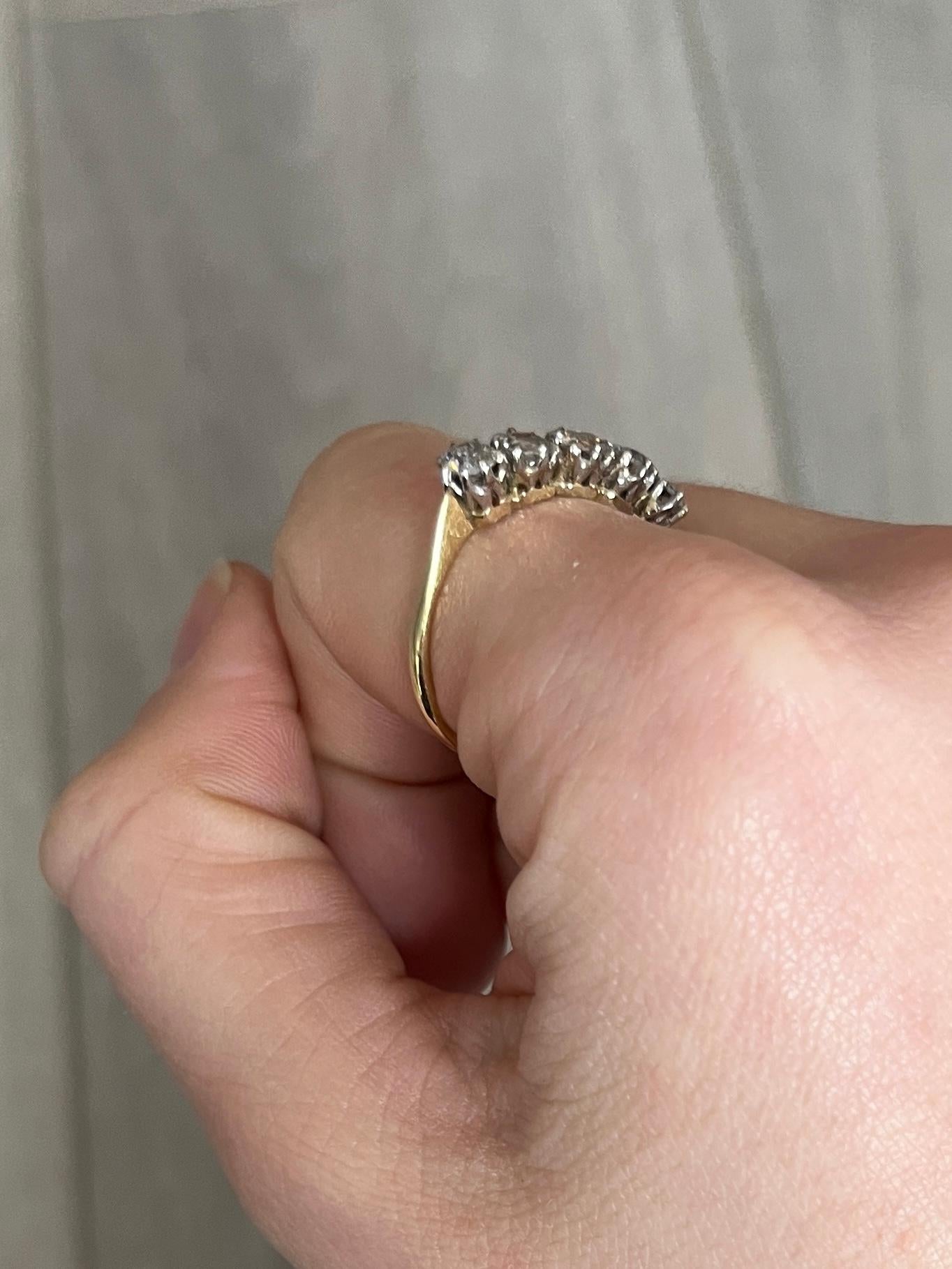 Five glistening diamonds sit fabulously on top of a simple open work claw setting modelled in platinum. The diamonds total 1.3ct. This ring is modelled in 18carat gold. 

Ring Size: O 1/2 or 7 1/2 
Height off finger: 4mm

Weight: 2.5g