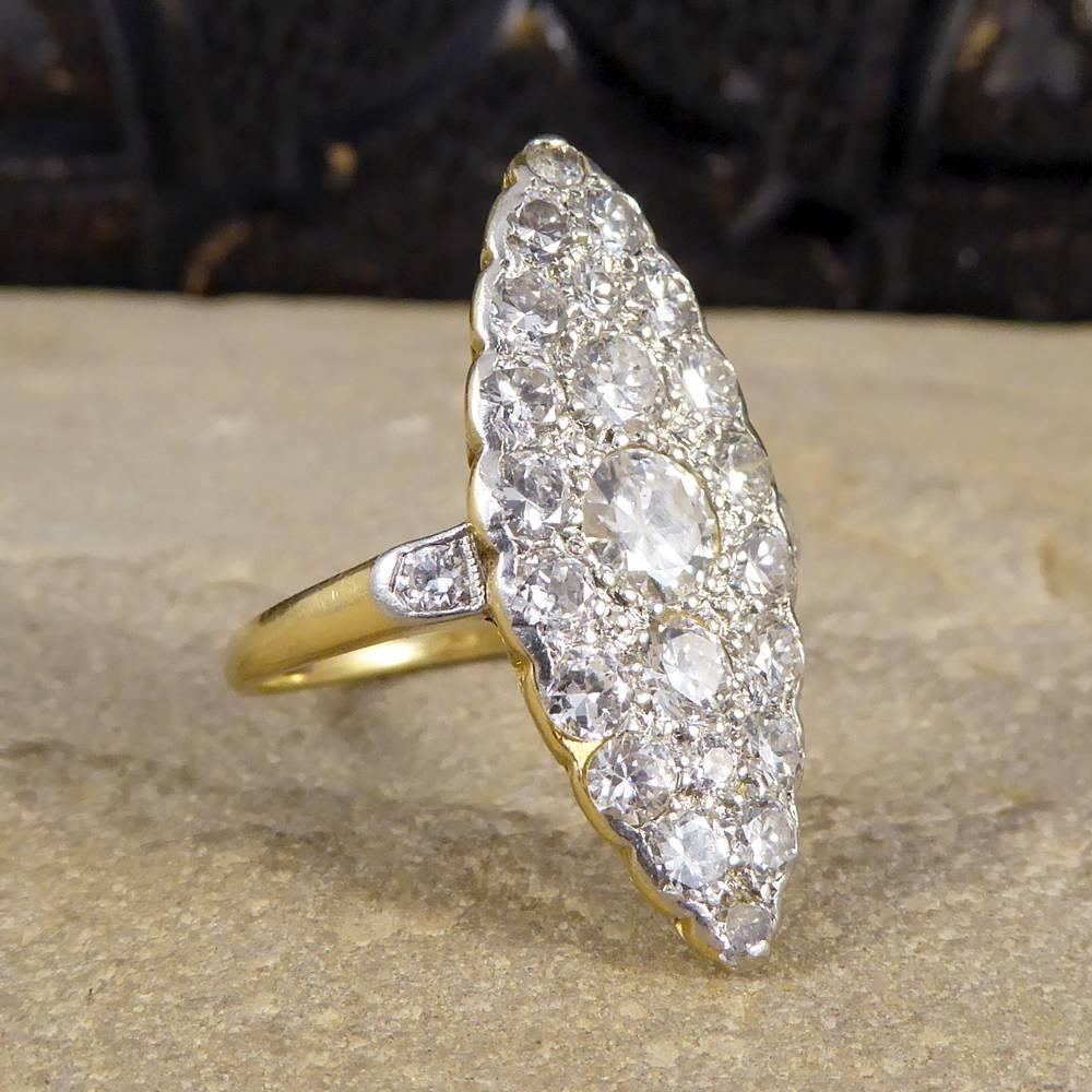 With a centre Diamond weighing 0.50ct, this ring holds 2.30ct in total and sparkles so brightly on the finger in its marquise shape. This ring has been designed and made in the Edwardian era using both 18ct Yellow Gold and Platinum, seeing the