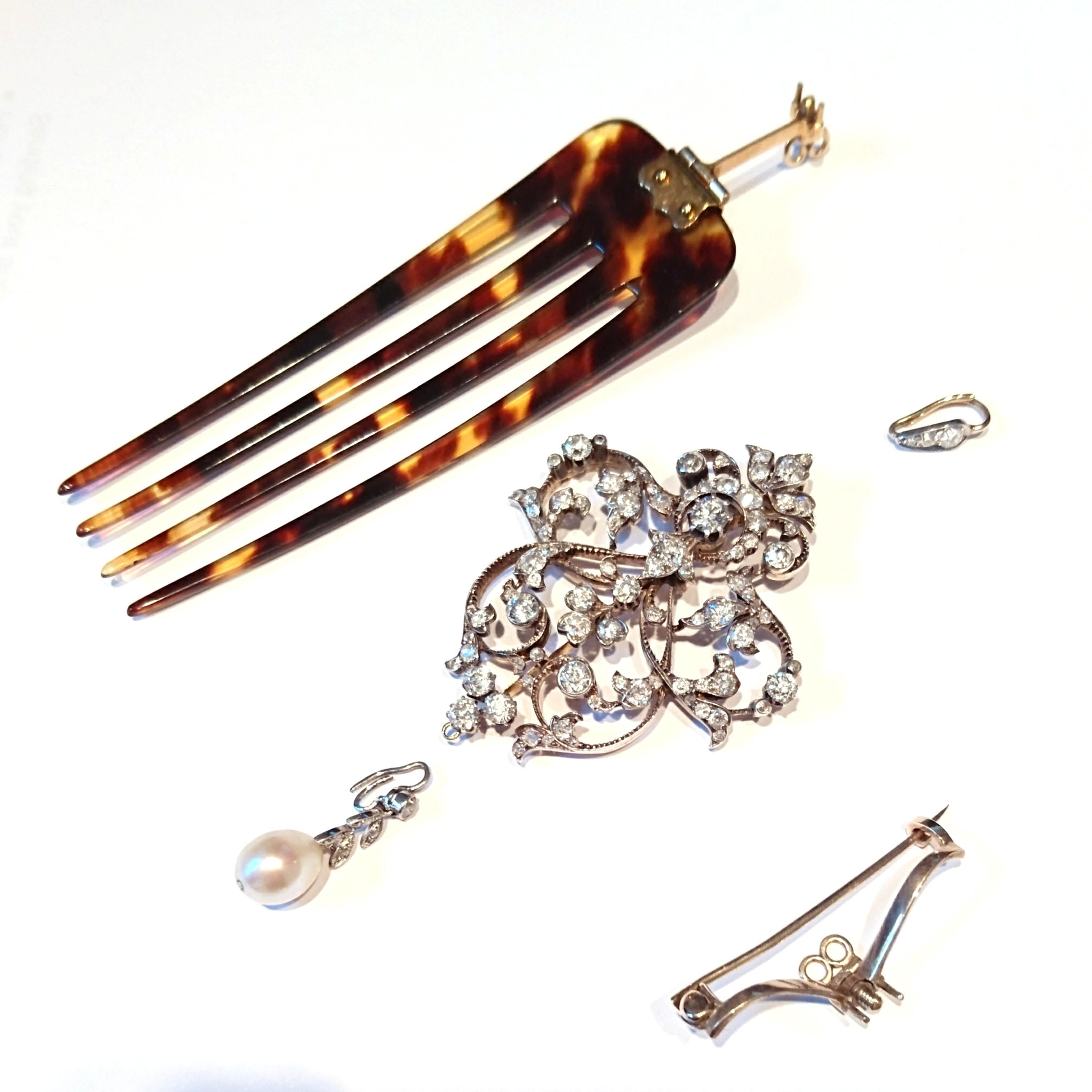 An Edwardian diamond and pearl brooch-cum-pendant, with hair comb fitting, set with old-cut diamonds and a removable natural pearl drop pendant, mounted in silver-upon-gold, with millegrain edges, in a fitted Hancocks & Co case, circa