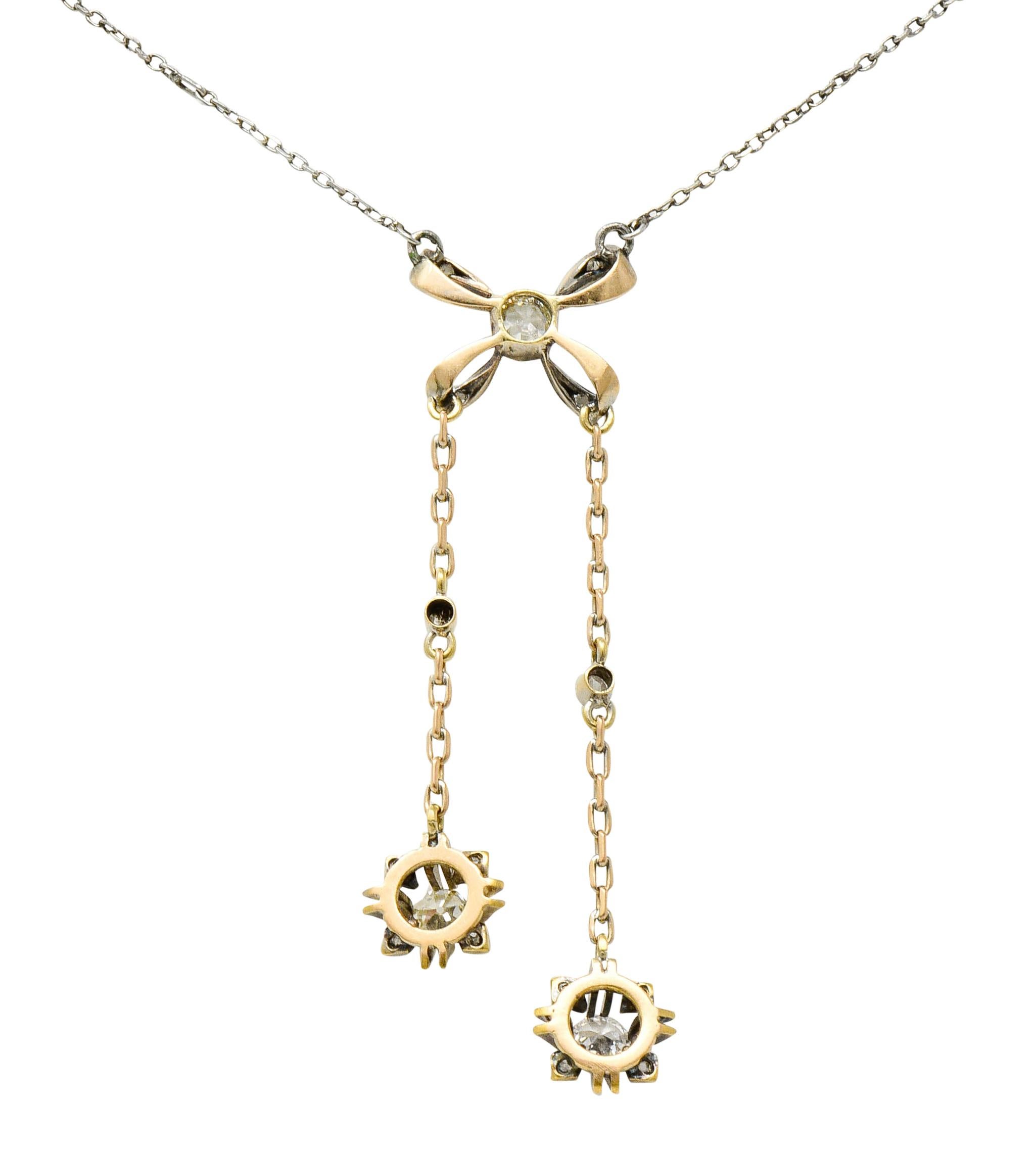 Edwardian Diamond Platinum 14 Karat Gold Bow Lariat Necklace In Excellent Condition In Philadelphia, PA