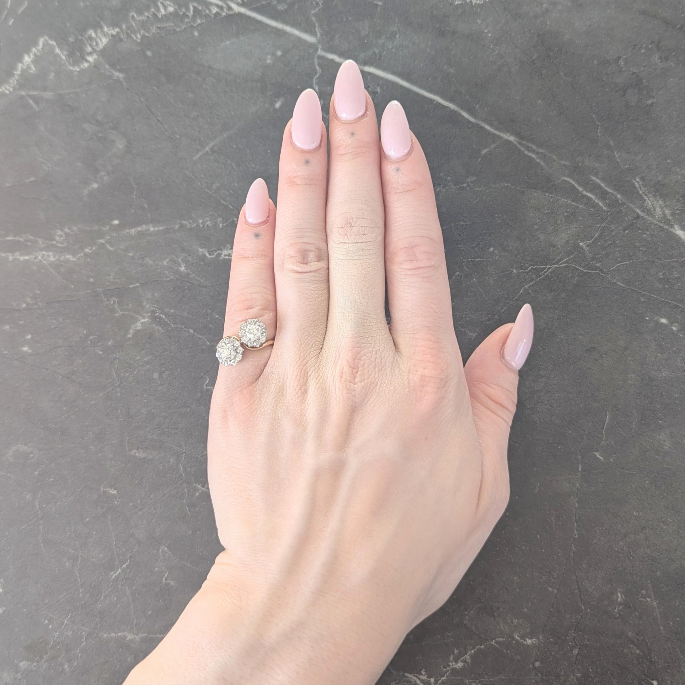 Designed as a yellow gold bypass, toi-et-moi style ring - French for 