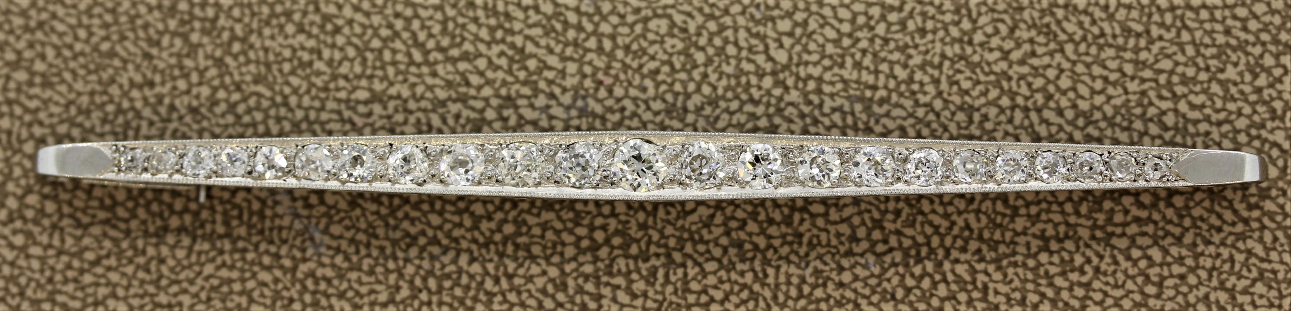 A classic piece from the early 1900’s, this Edwardian treasure features approximately 2 carats of old mine cut diamonds. Set in a long platinum bar, this piece is still in original condition.

Length: 3.5 inches