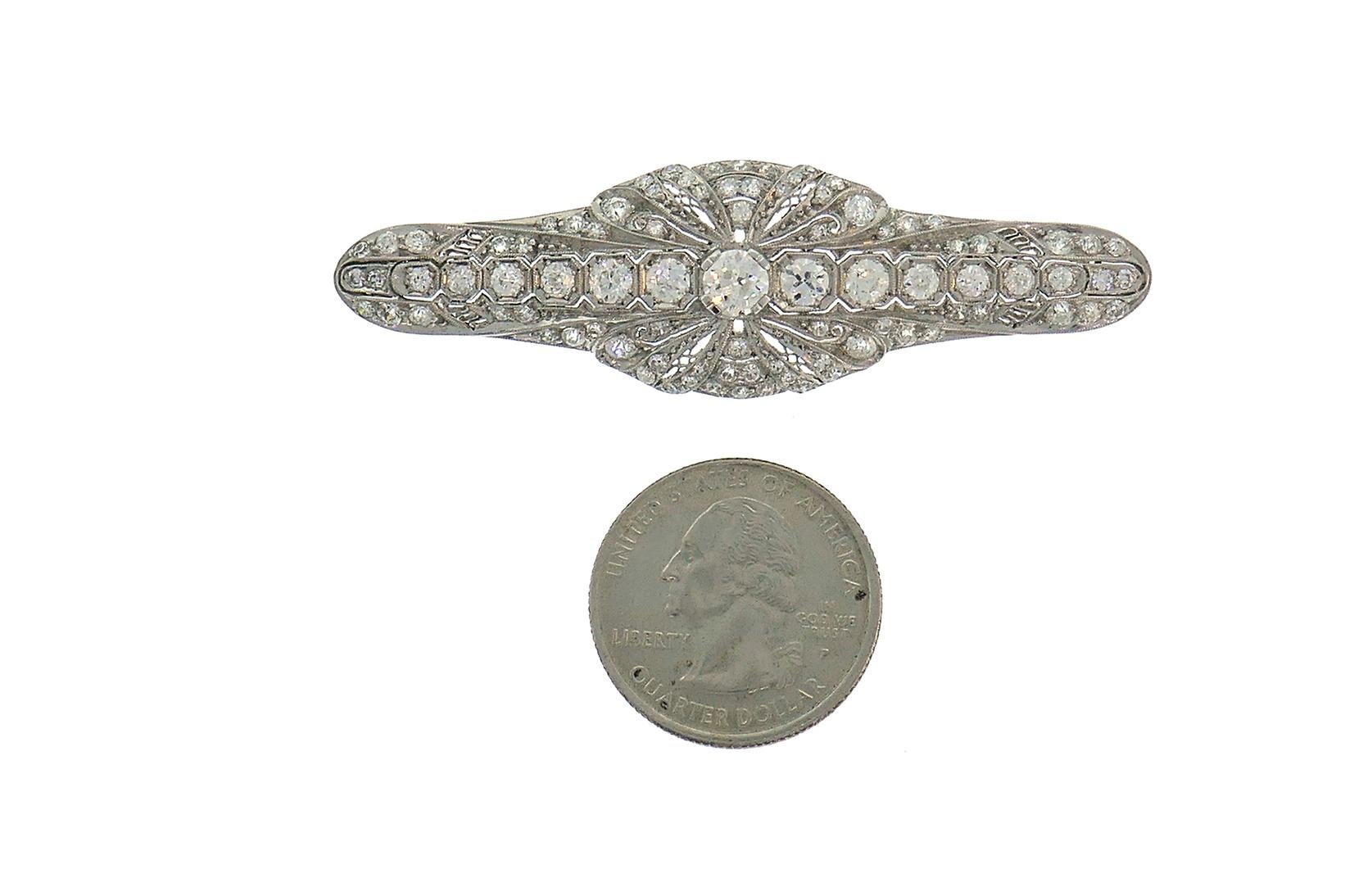 Classy Art Deco/Edwardian brooch created in the 1920-30s. 
Made of platinum (stamped) and set with Old European cut diamonds. The diamonds are G-I color, VS clarity, total weight approximately 3.50 carats. 
The pin stem is made of white