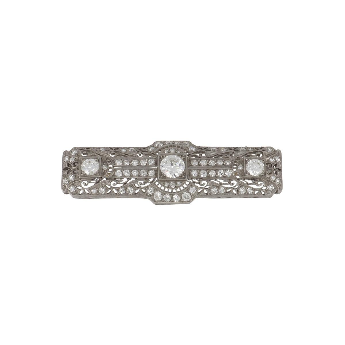 An Edwardian platinum filigree rectangular bar pin, set with 2.50 carats of diamonds. Circa 1915